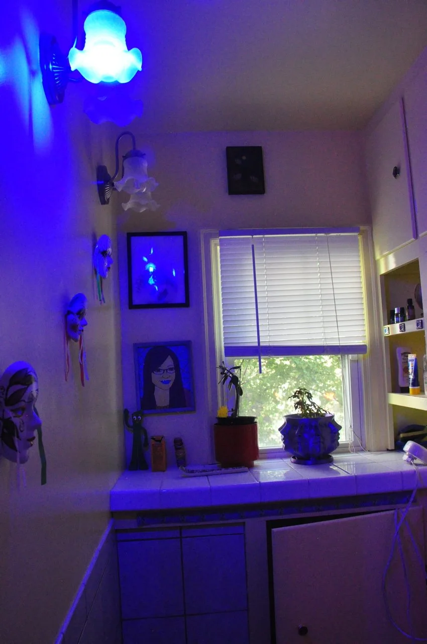 Blue light with art on wall
