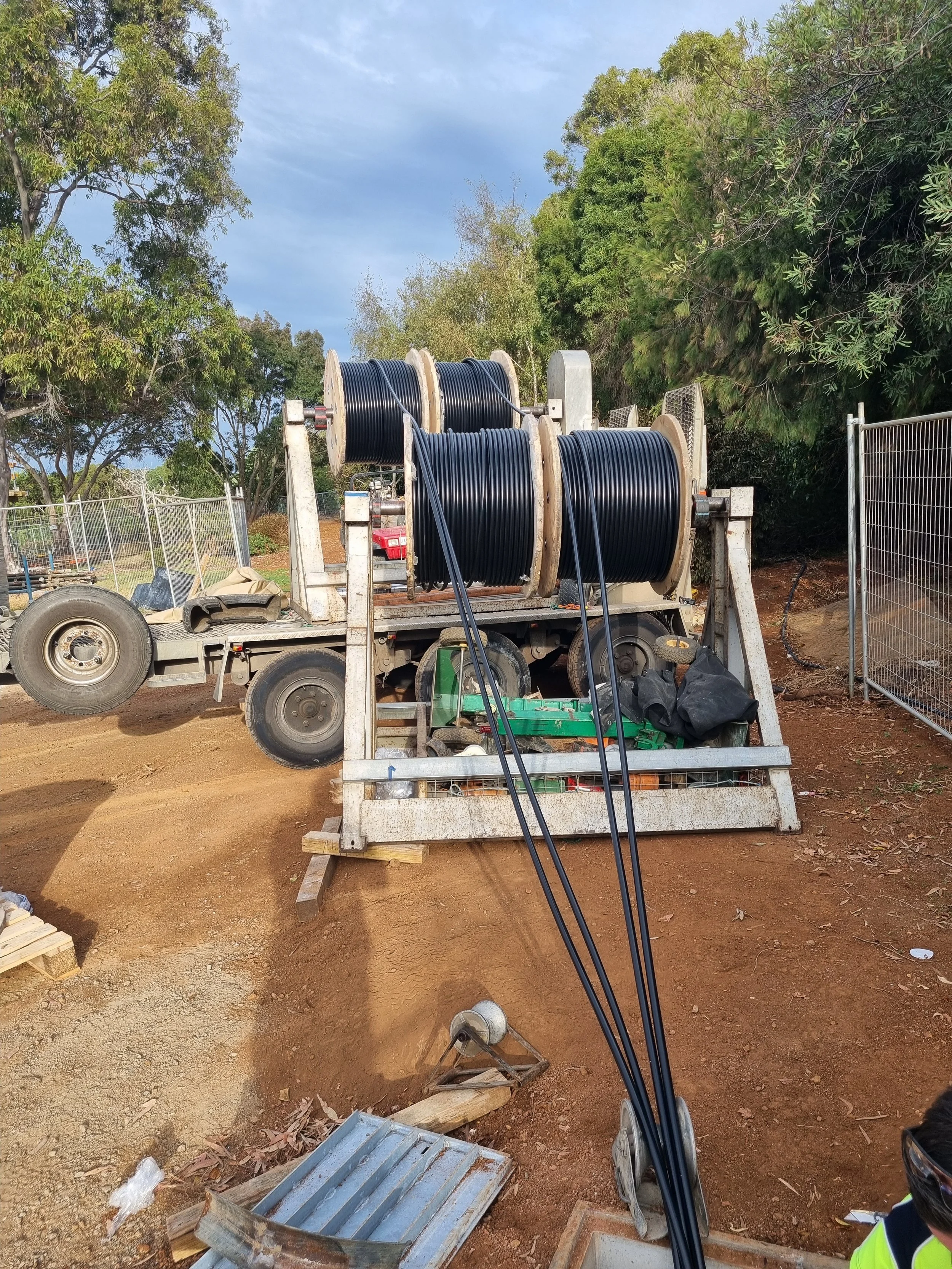 Cable drum setup on a trailer for ease of pull and reduce labour and manual handling