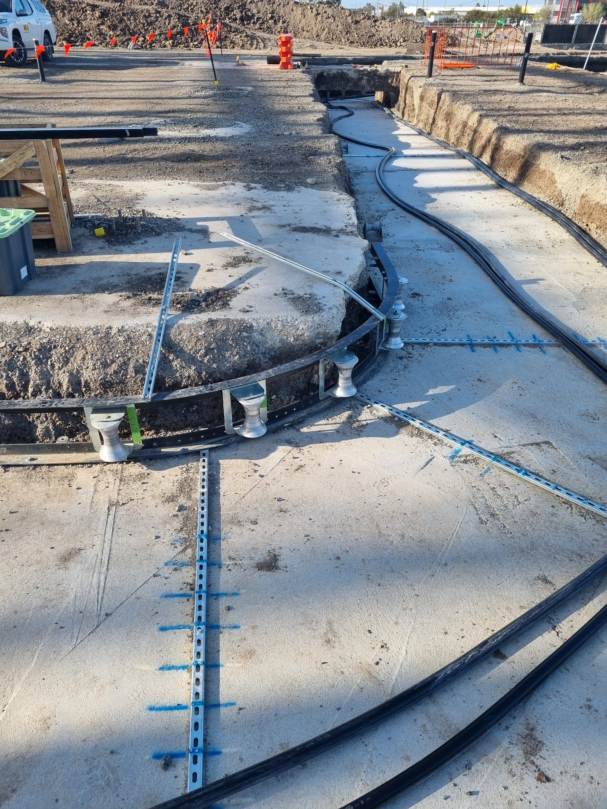 Roller setup for open trench