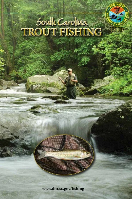 A person stands in a river fishing for trout in South Carolina, with thick green trees in the background. There is a close-up of a caught trout in a circular inset, and official South Carolina DNR (Department of Natural Resources) logo at the top right.