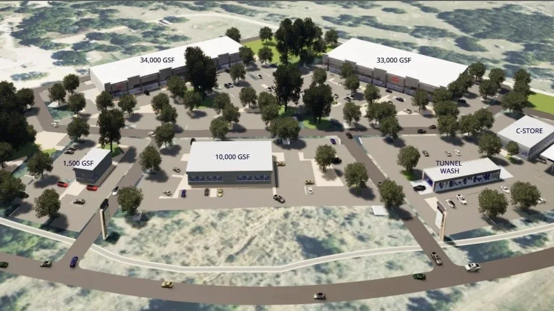 A 3D rendering of a commercial complex with multiple buildings, trees, and parking lots, labeled with square footage such as 34,000 GSF, 33,000 GSF, 10,000 GSF, and 1,500 GSF. Features include a tunnel wash and a C-store.