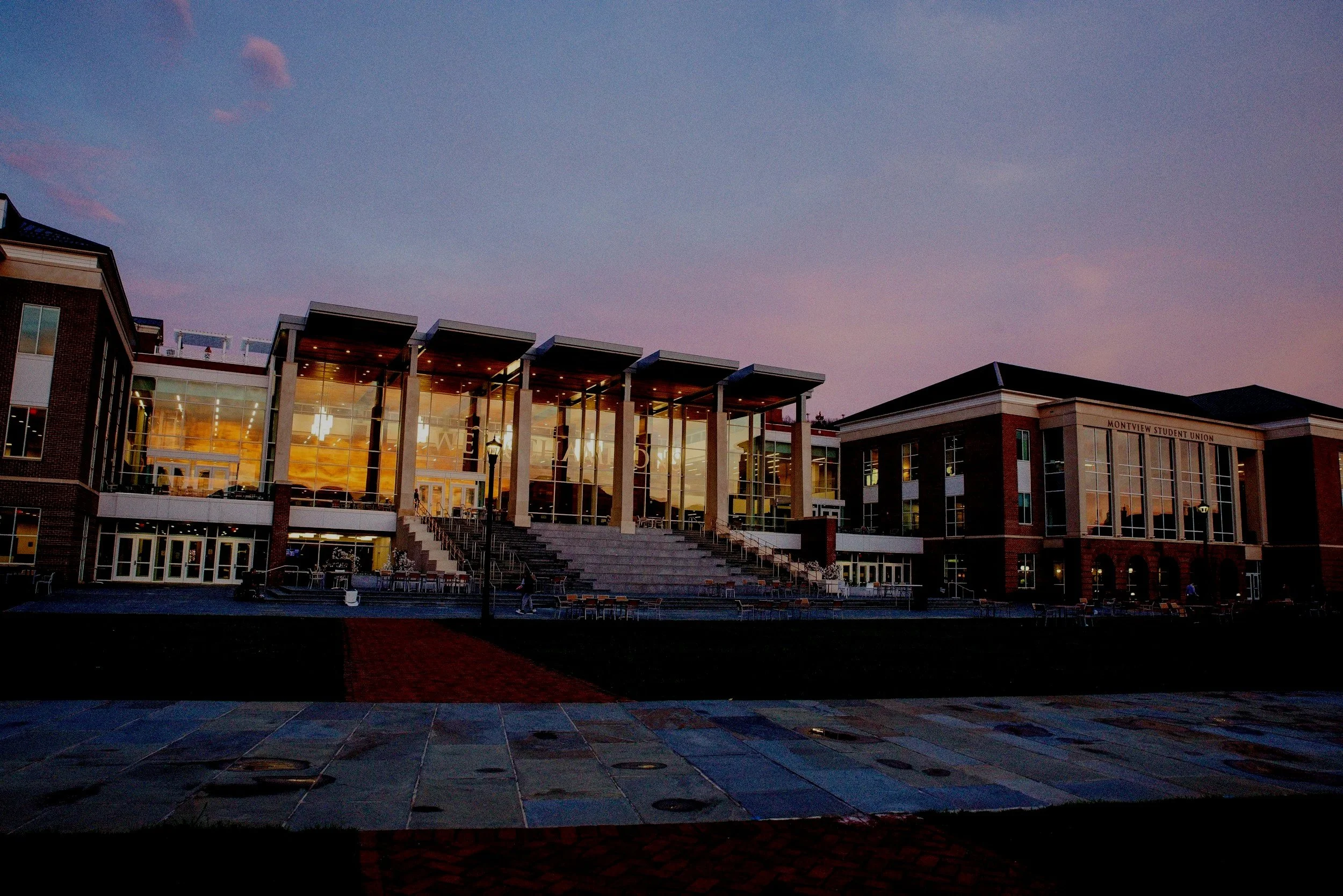 Exterior of a large college campus building representing the university environment