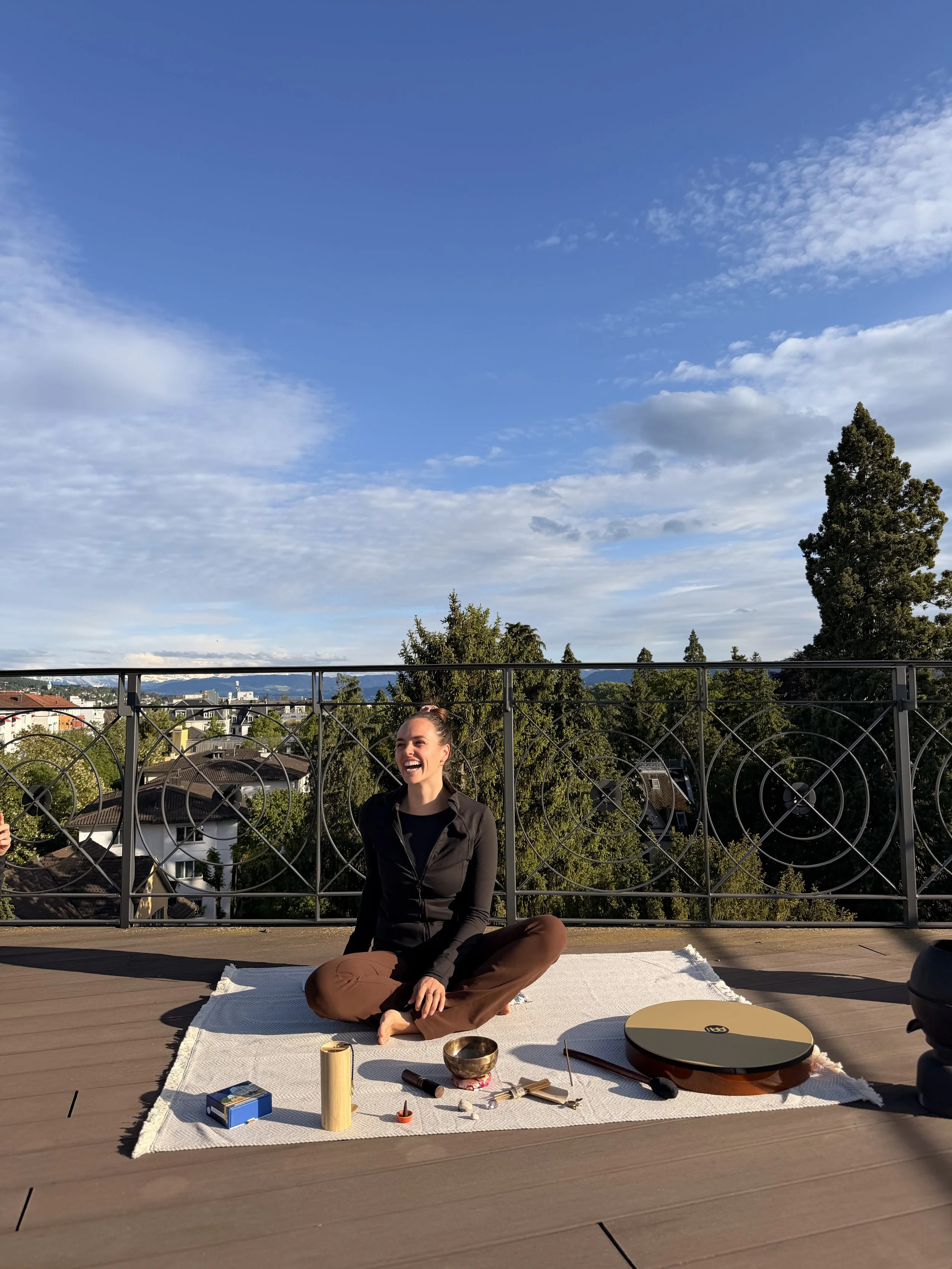 Picture showing Alina on rooftop starting the yoga class