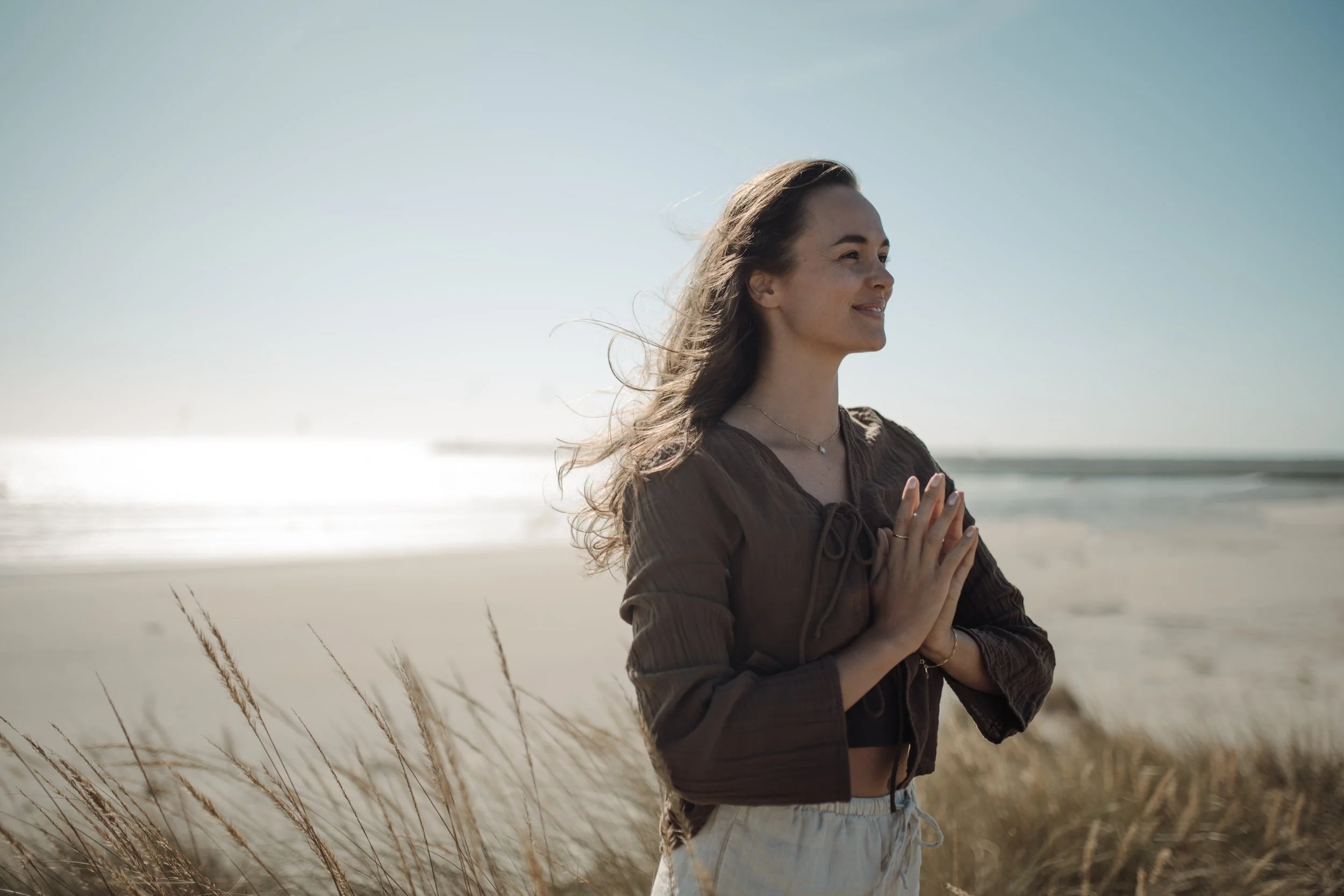 Alina with hands together in front of the heart