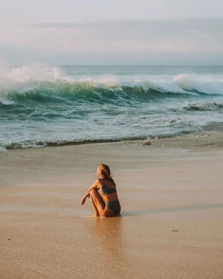 woman sitting at the beach Portugal