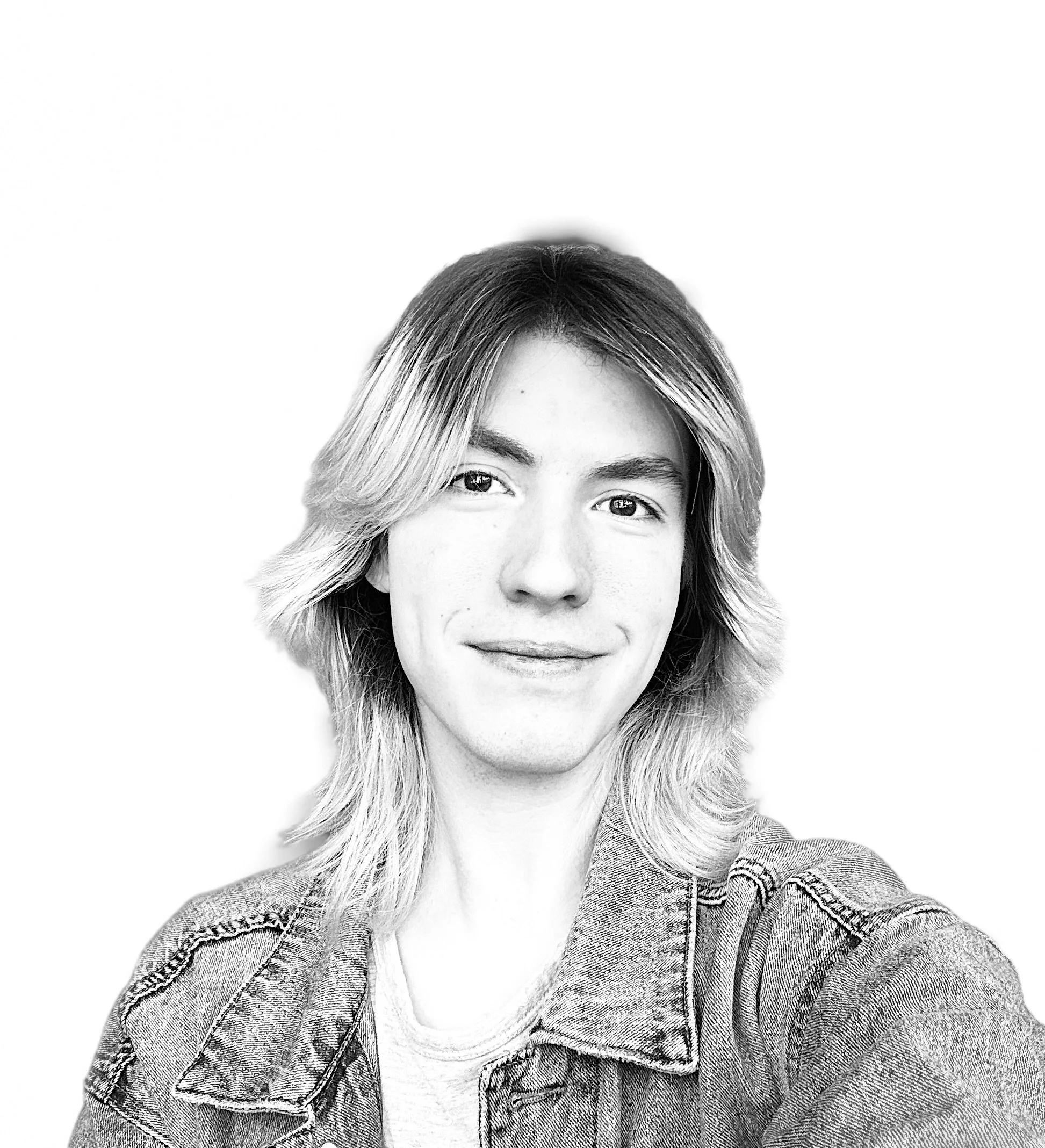 A black and white portrait of a smiling woman with shoulder-length wavy hair wearing a denim jacket.