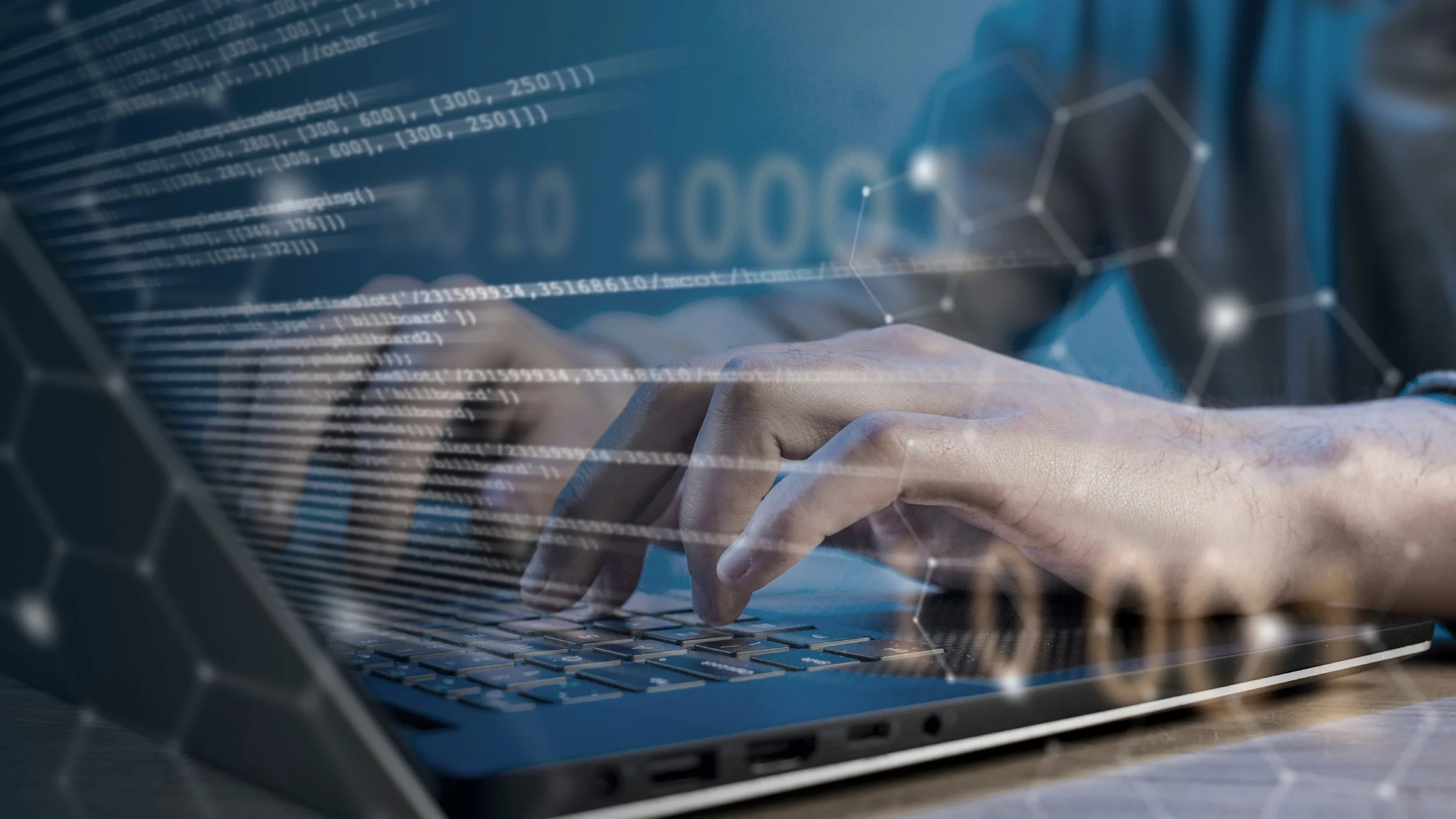 Close-up of a person's hand typing on a laptop keyboard, with digital data, code, and holographic hexagonal graphics overlayed, indicating technology and cybersecurity themes.