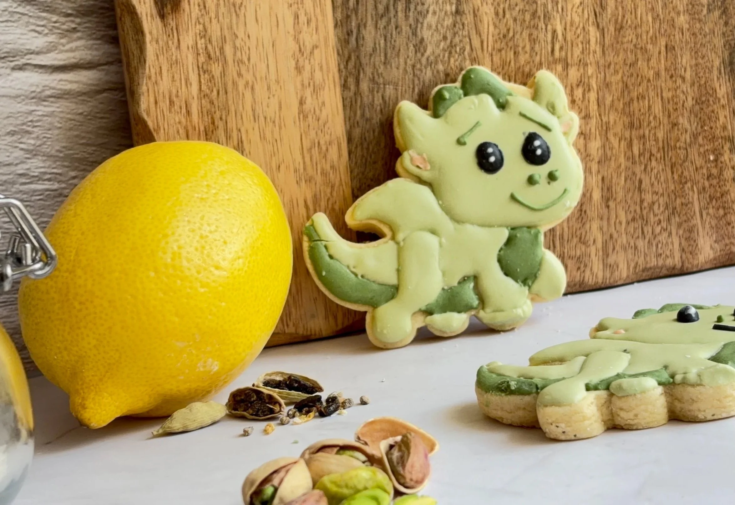 Sugar & Sorcery's baby dragon cookies in green, with lemon, cardamom, and pistachios