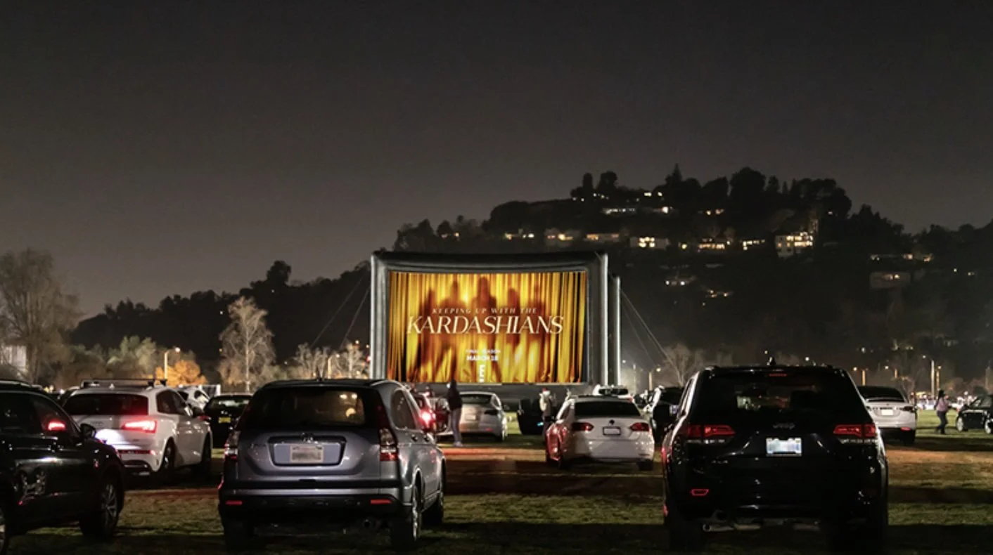 A row of cars parked and lined up for the Kardashians Drive-In Screening