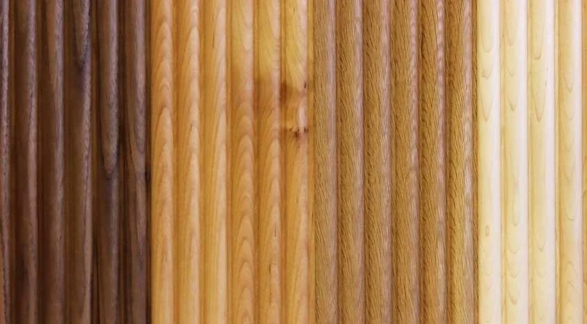 Close-up of a wood surface showing different shades and grain patterns.