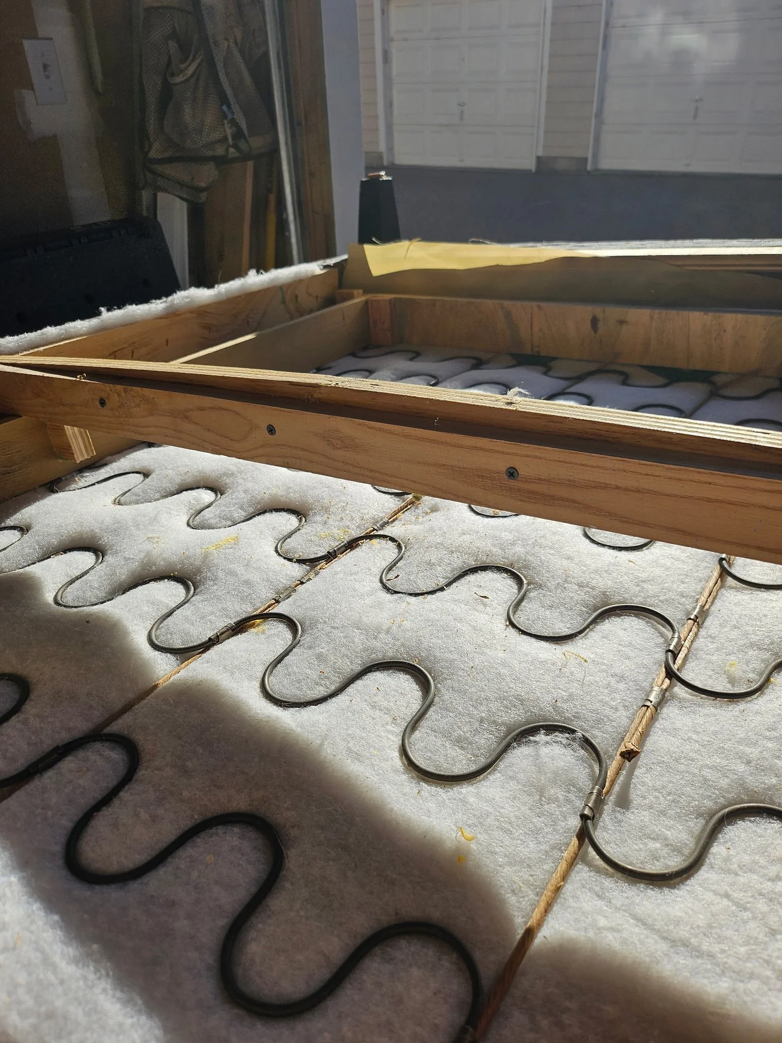 Upholstered furniture frame opened for internal wood repair