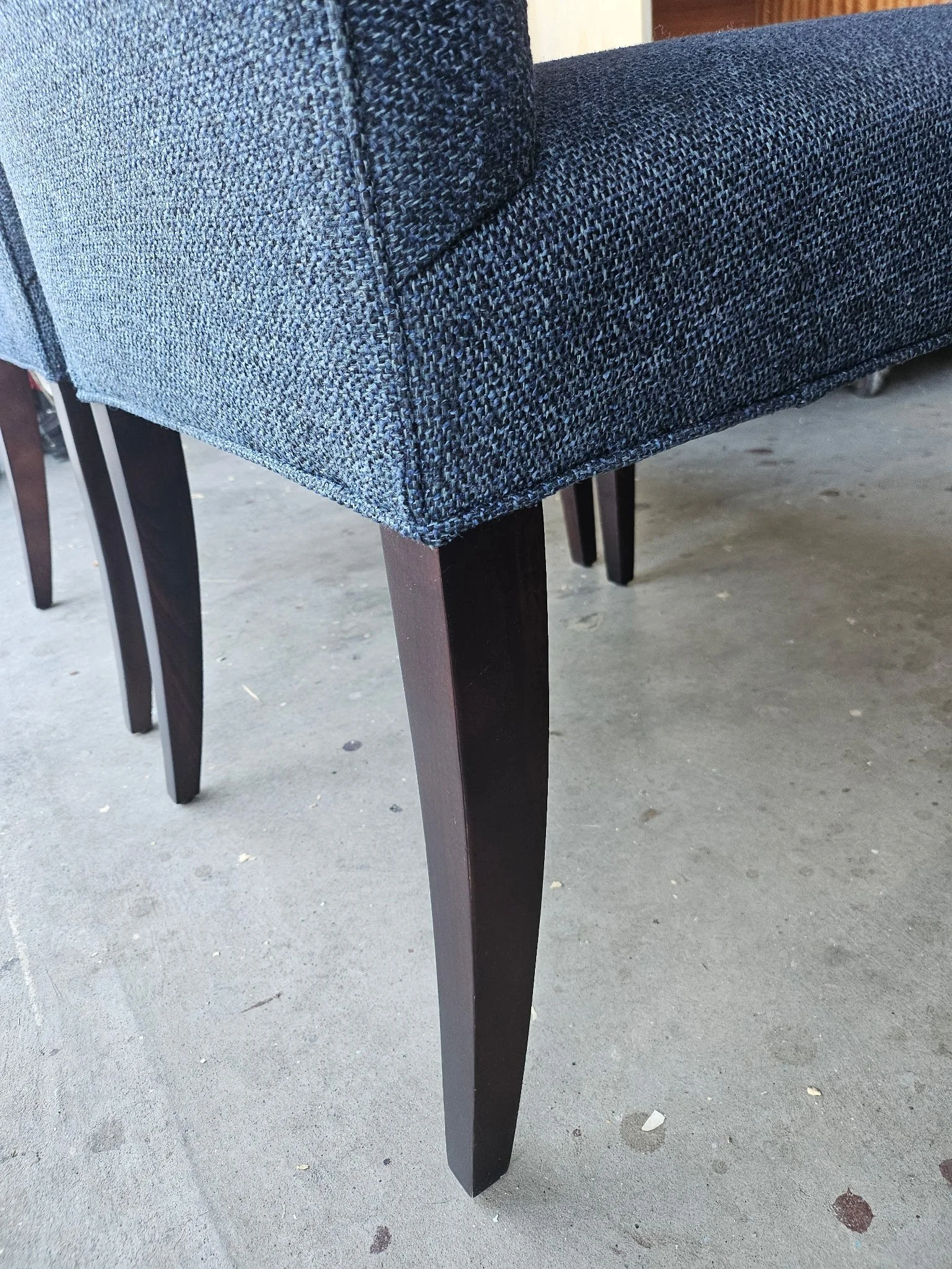 Upholstered dining chair with restored dark wood legs