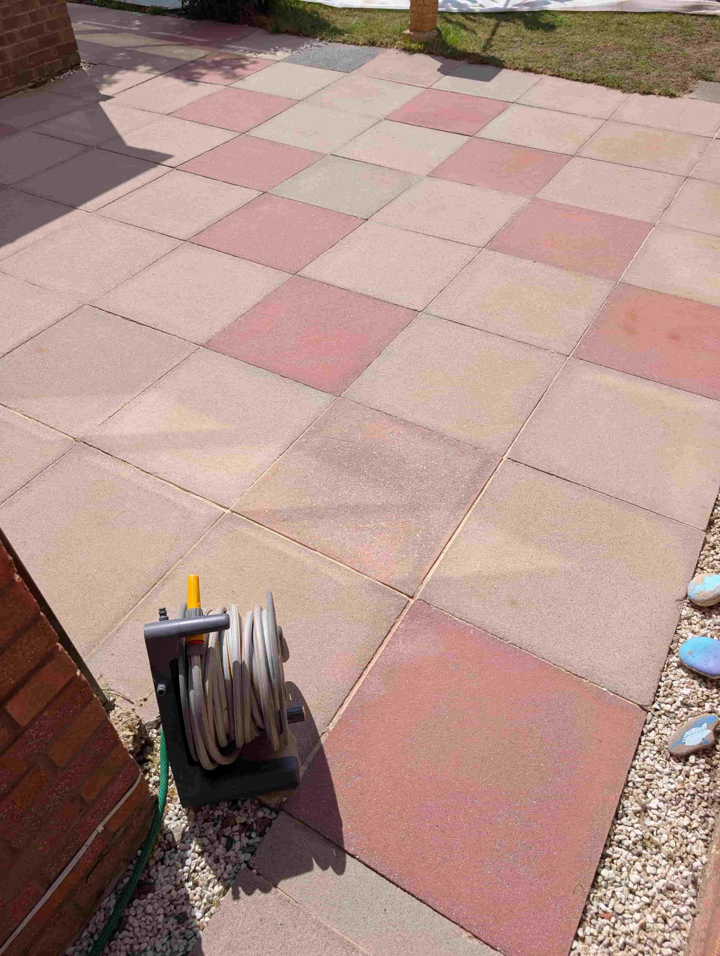 View of newly cleaned, chemically treated and re-sanded concrete patio slabs