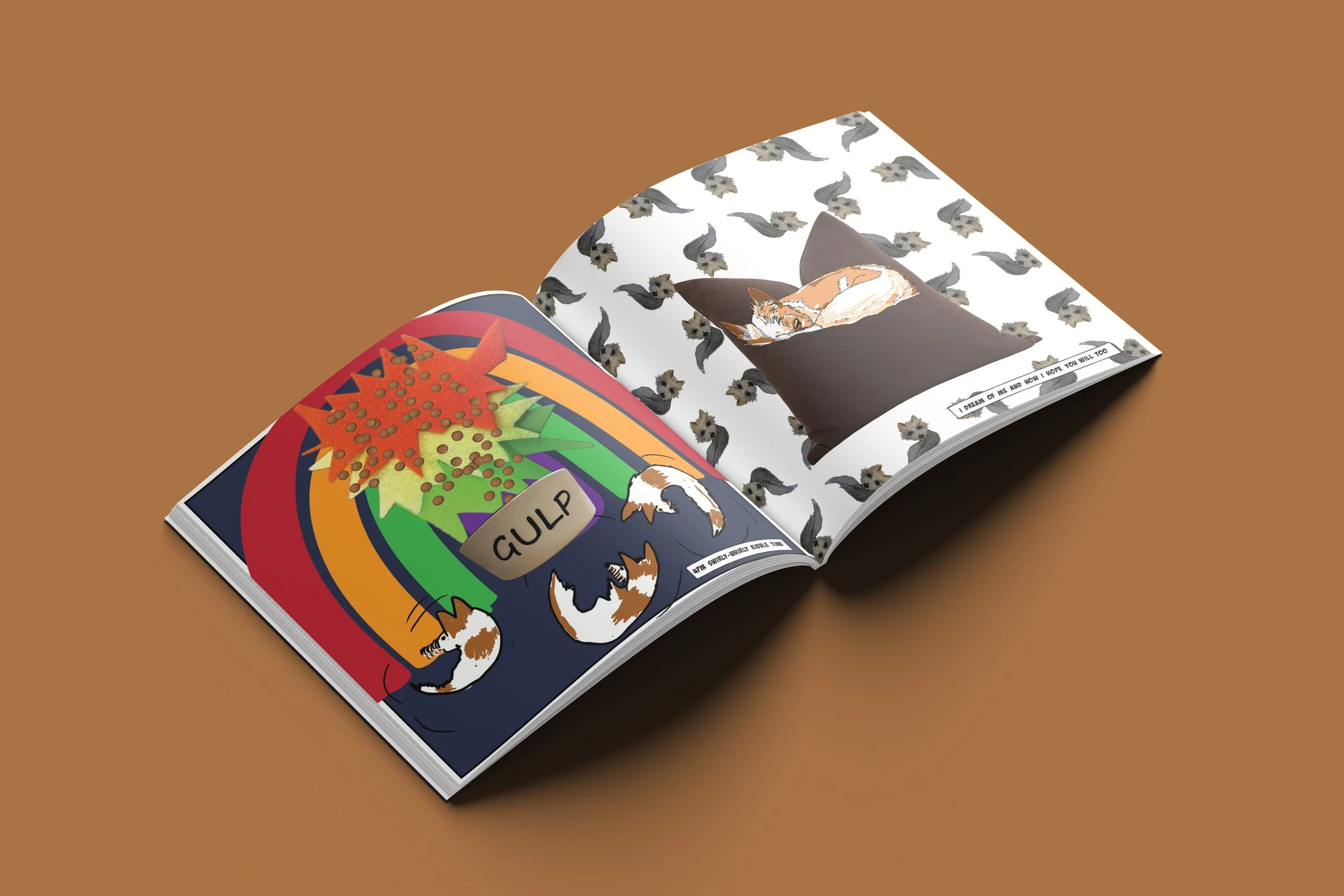 An open magazine with colorful pop art and illustrations of cats on the left page, and a photograph of a sleeping cat on a pillow with a background of multiple gray cats on the right page.