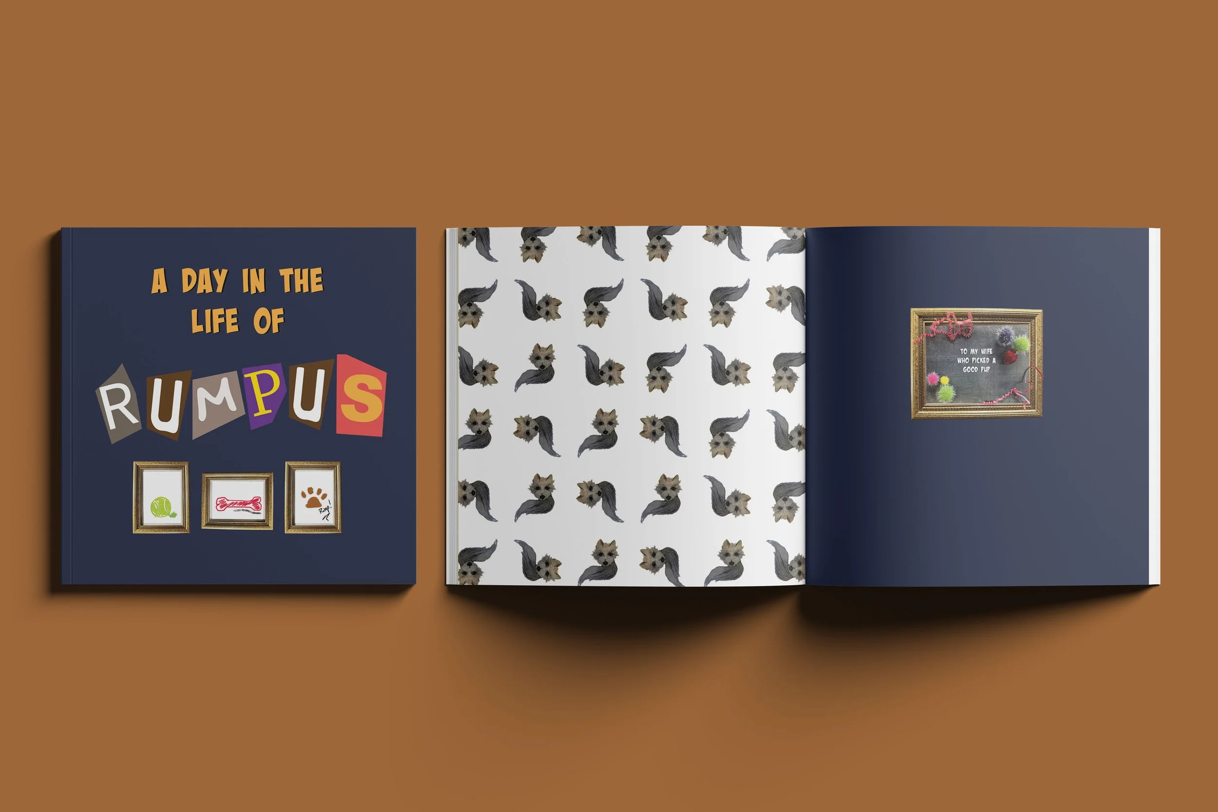 An open scrapbook featuring a title page that reads 'A Day in the Life of RUMPUS', with three picture frames and a patterned page with small dogs, and a page with a framed message.
