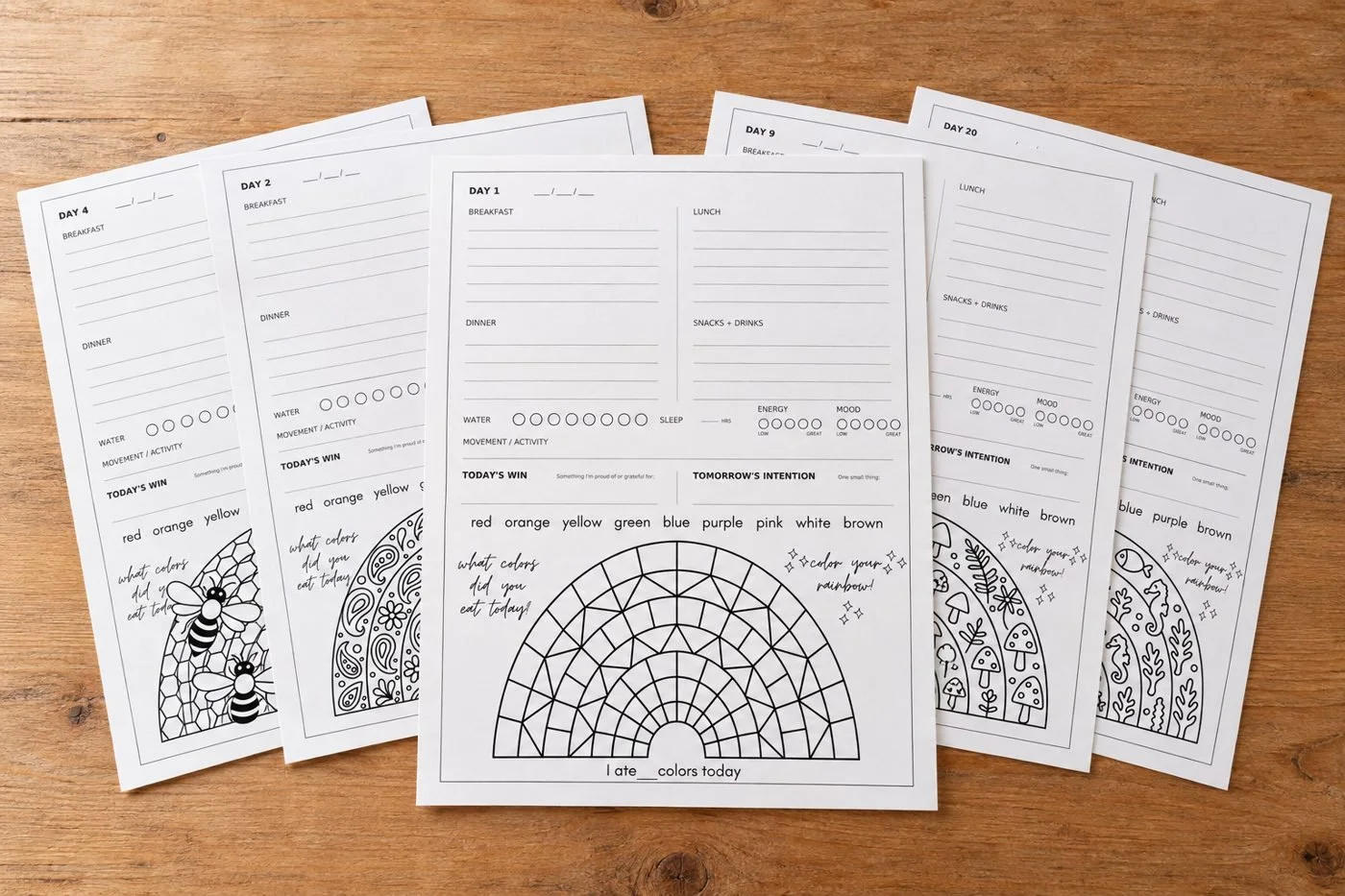 New Me! printable pages spread on a wooden table