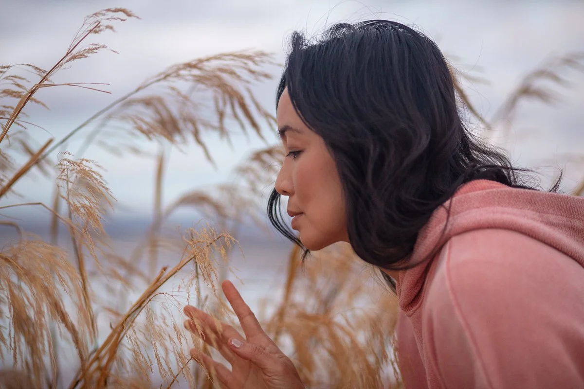 Side profile of woman with grass in background in Alviso Bay Area
