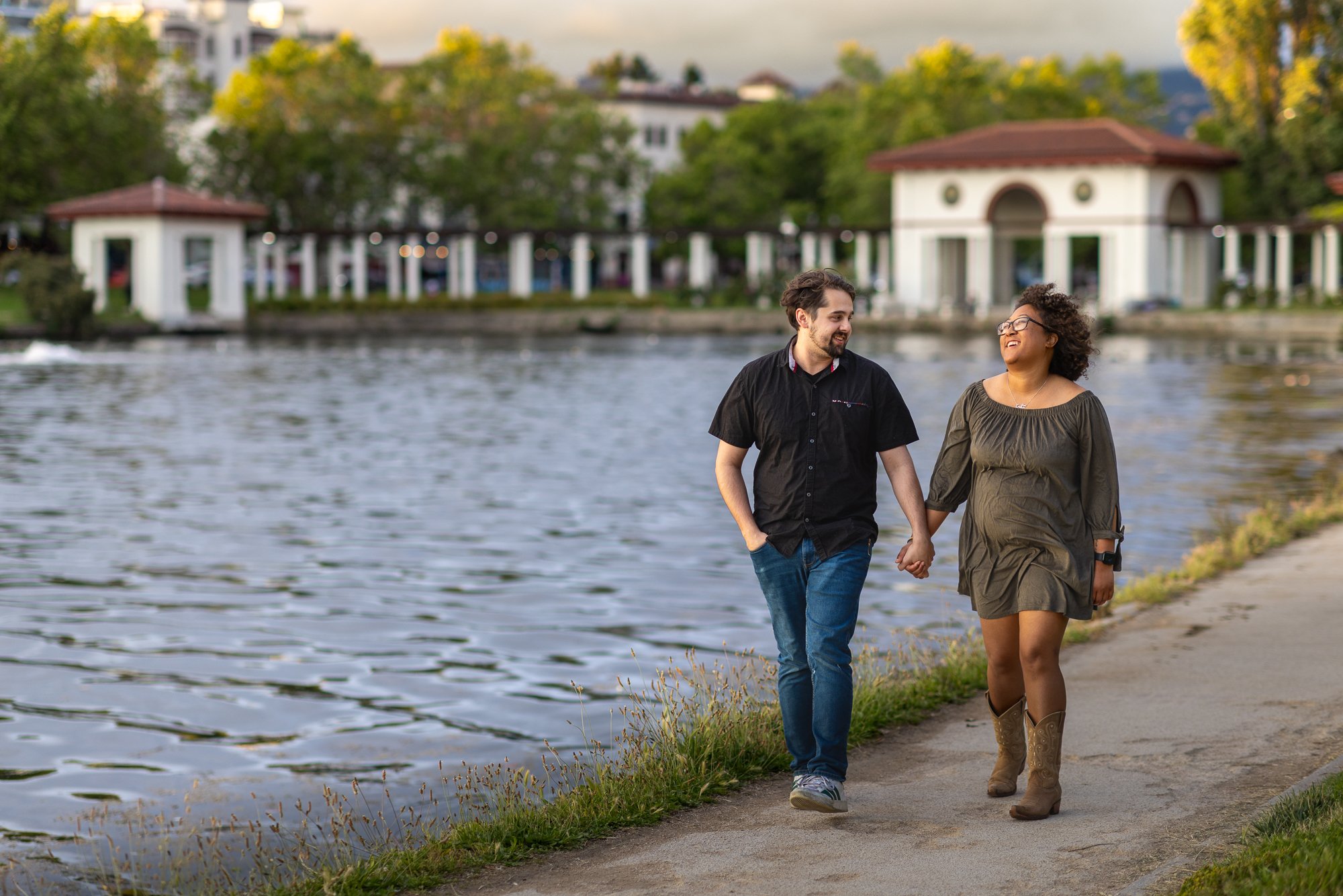Bay Area couples photographer walking shot at pergola colonnade with golden hour light