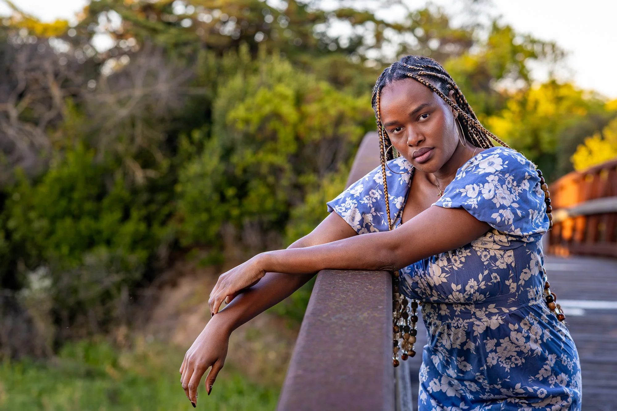 Mountain View personal lifestyle photographer Black model on rust footbridge Shoreline Park golden hour