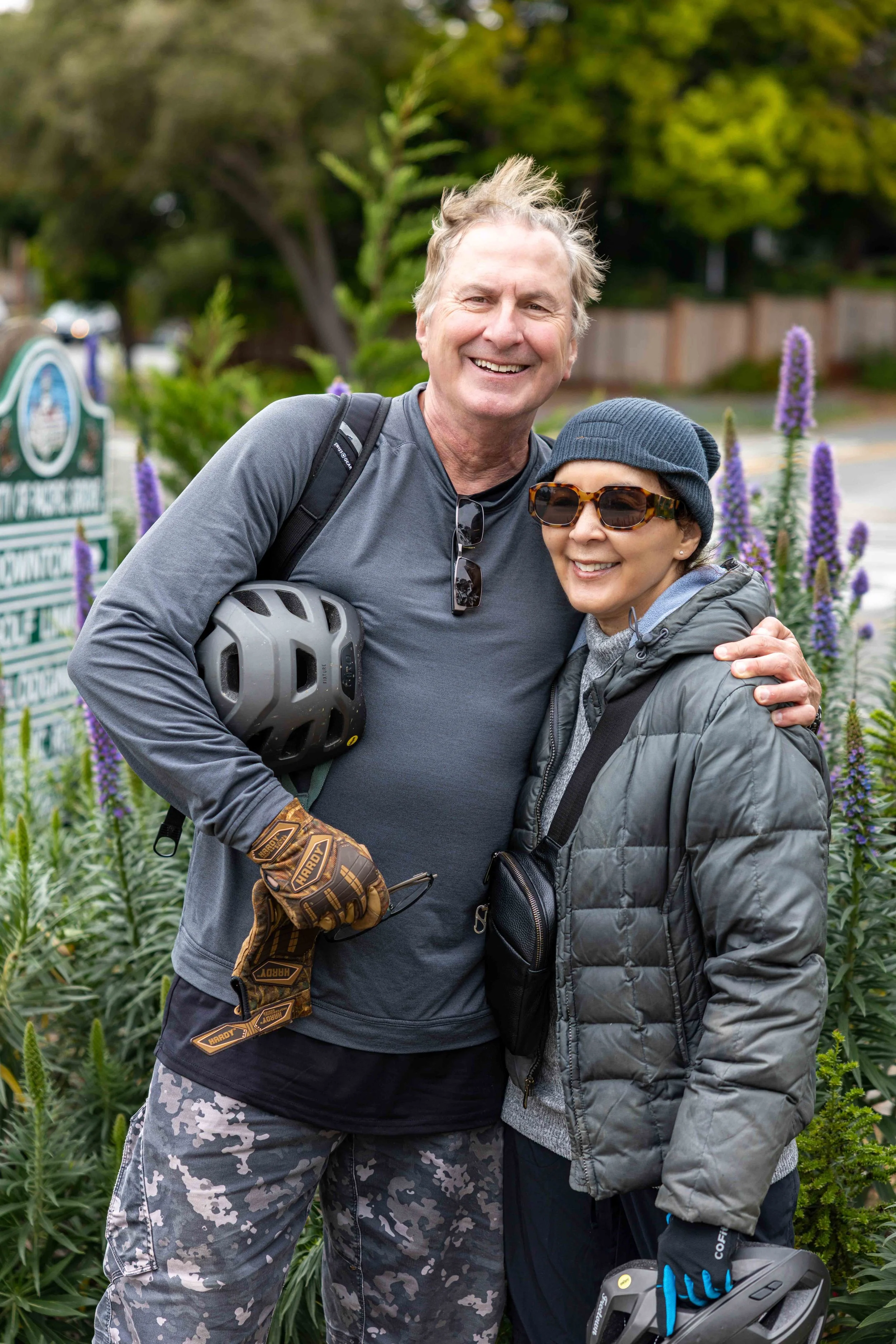 Couple hugging with lupine flowers - Pacific Grove 17 mile drive - Photography Outdoor Session