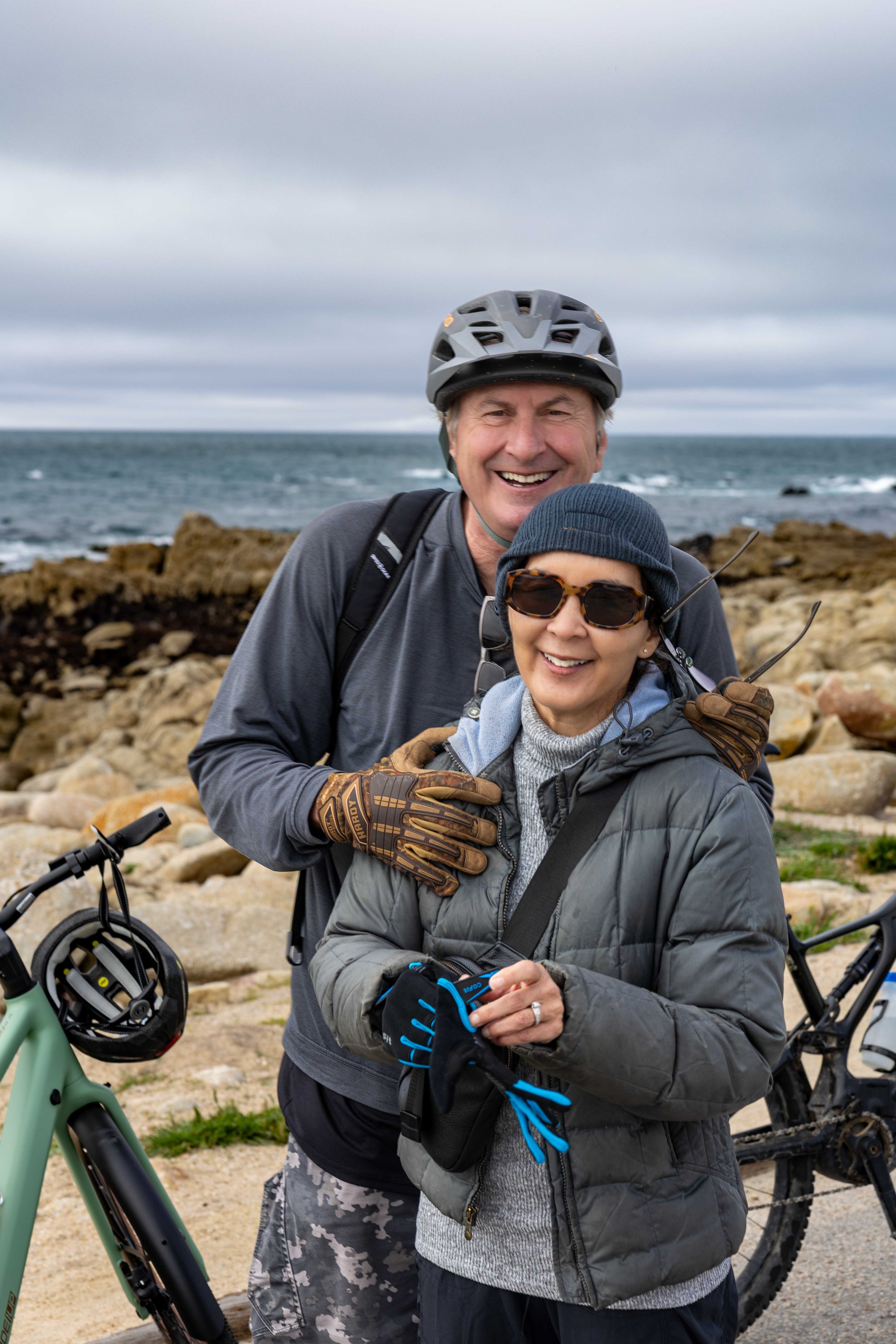 A quiet moment along the rocky Monterey Peninsula coastline — afternoon clouds creating soft, moody light during a full-day cycling photography session on 17 Mile Drive.