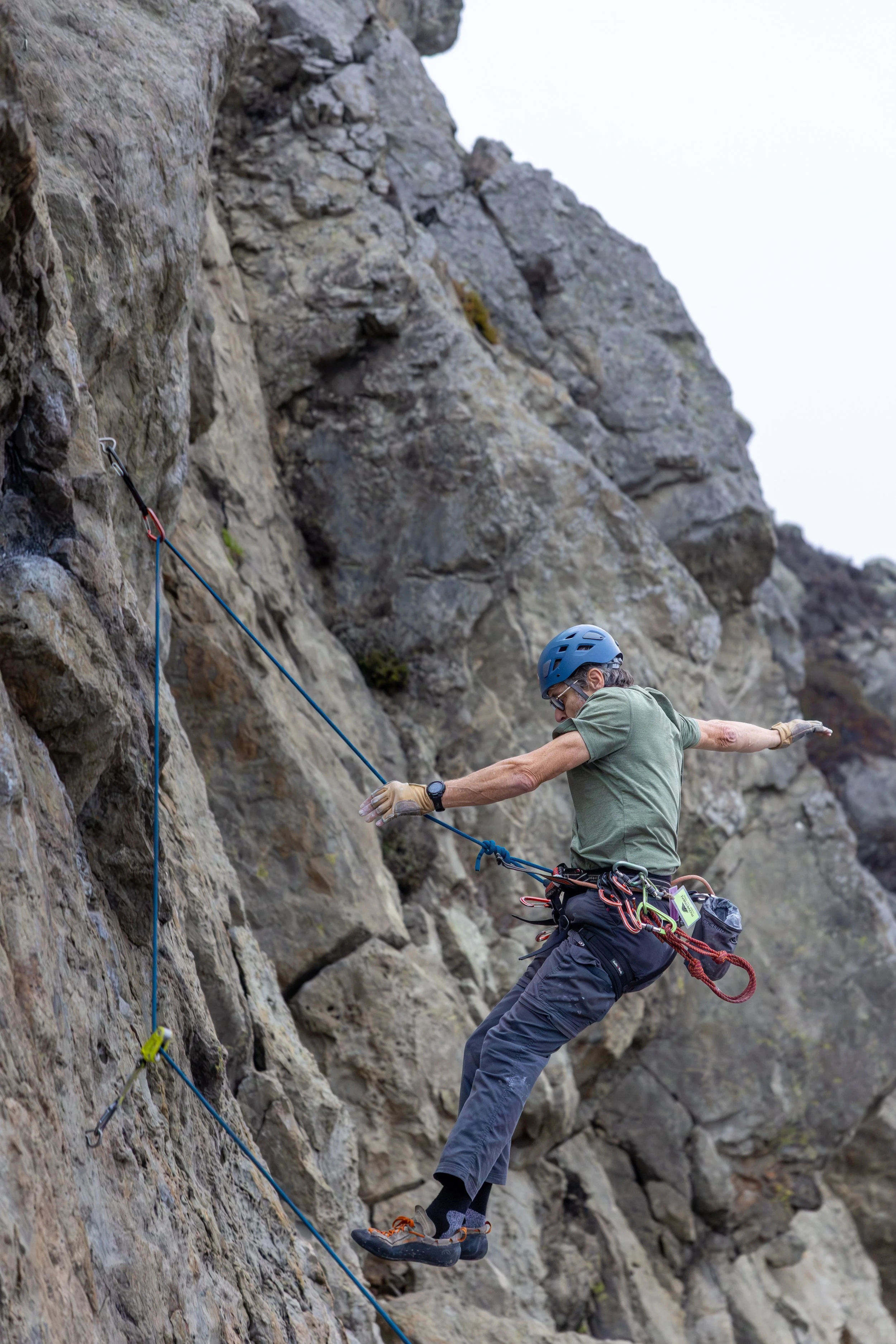 Action shot of man falling at Mickey's Beach rock climbing action photography session by Matthew Duncan