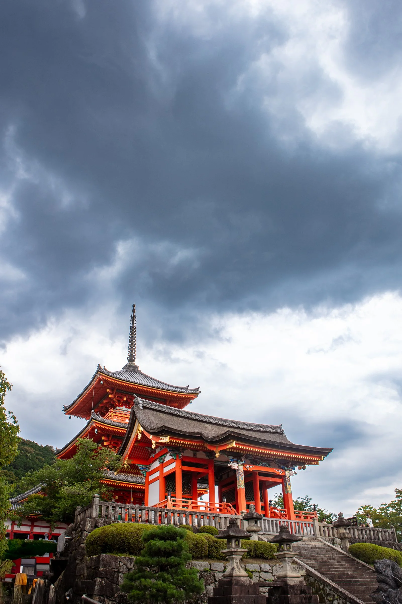 Kiyomizudera pagoda gate storm clouds dramatic sky Kyoto Japan