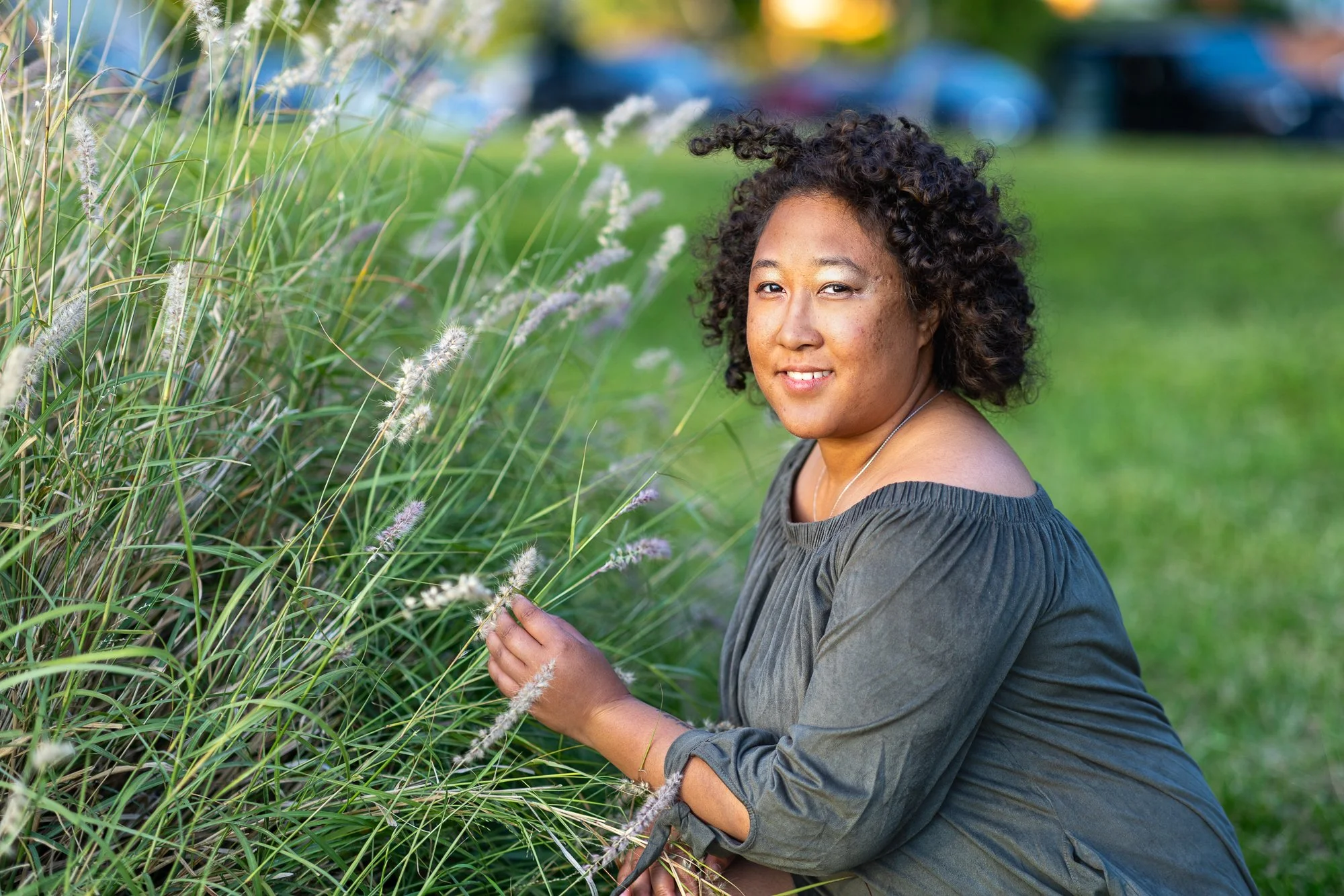 Bay Area couples photography woman in fountain grass with golden side light