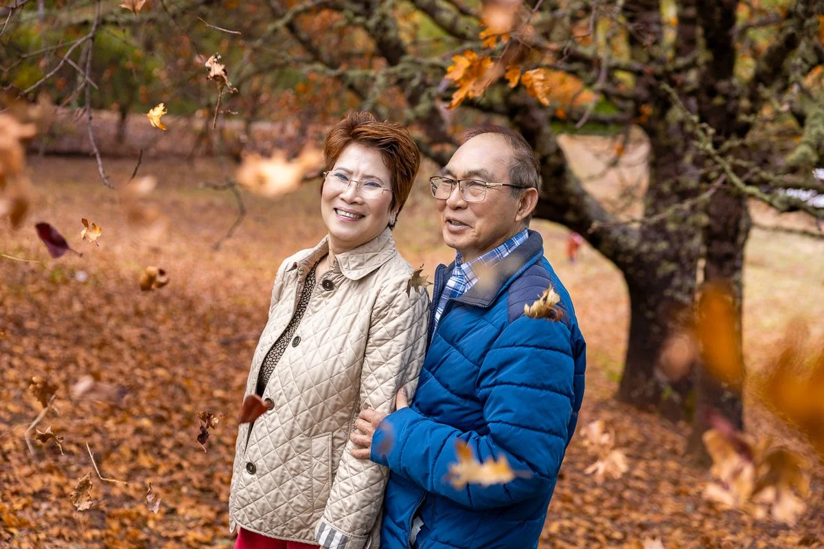 Couple with fall leaves in Santa Cruz Mountains