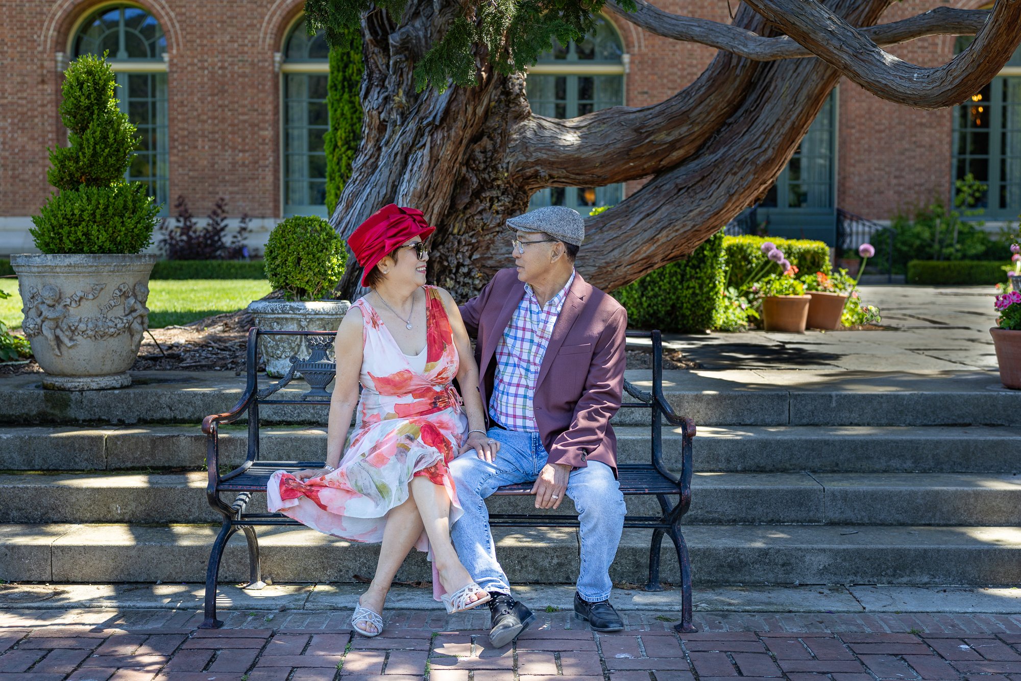 Older couple sitting on chair at Filoli Gardens