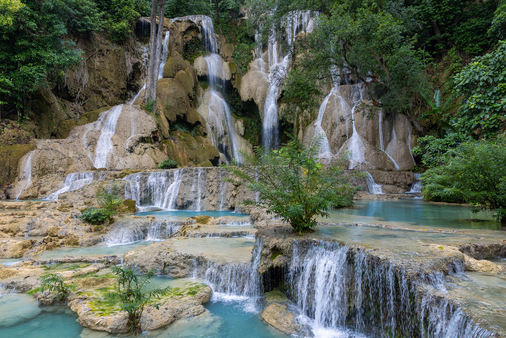 Main tiered cascade at Kuang Si Falls flowing over limestone, Luang Prabang, Laos
