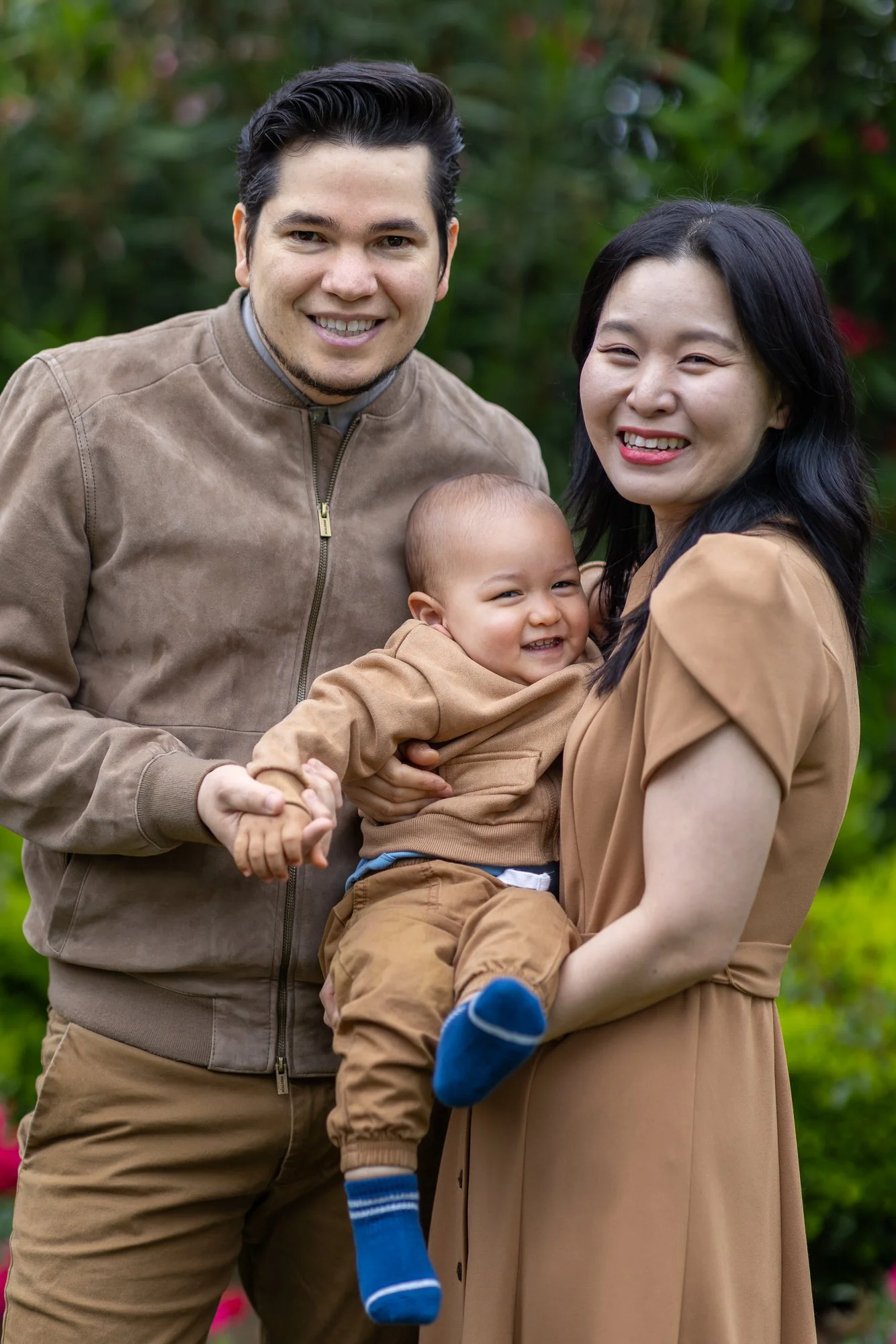 Mountain View family of three standing together at outdoor photography session