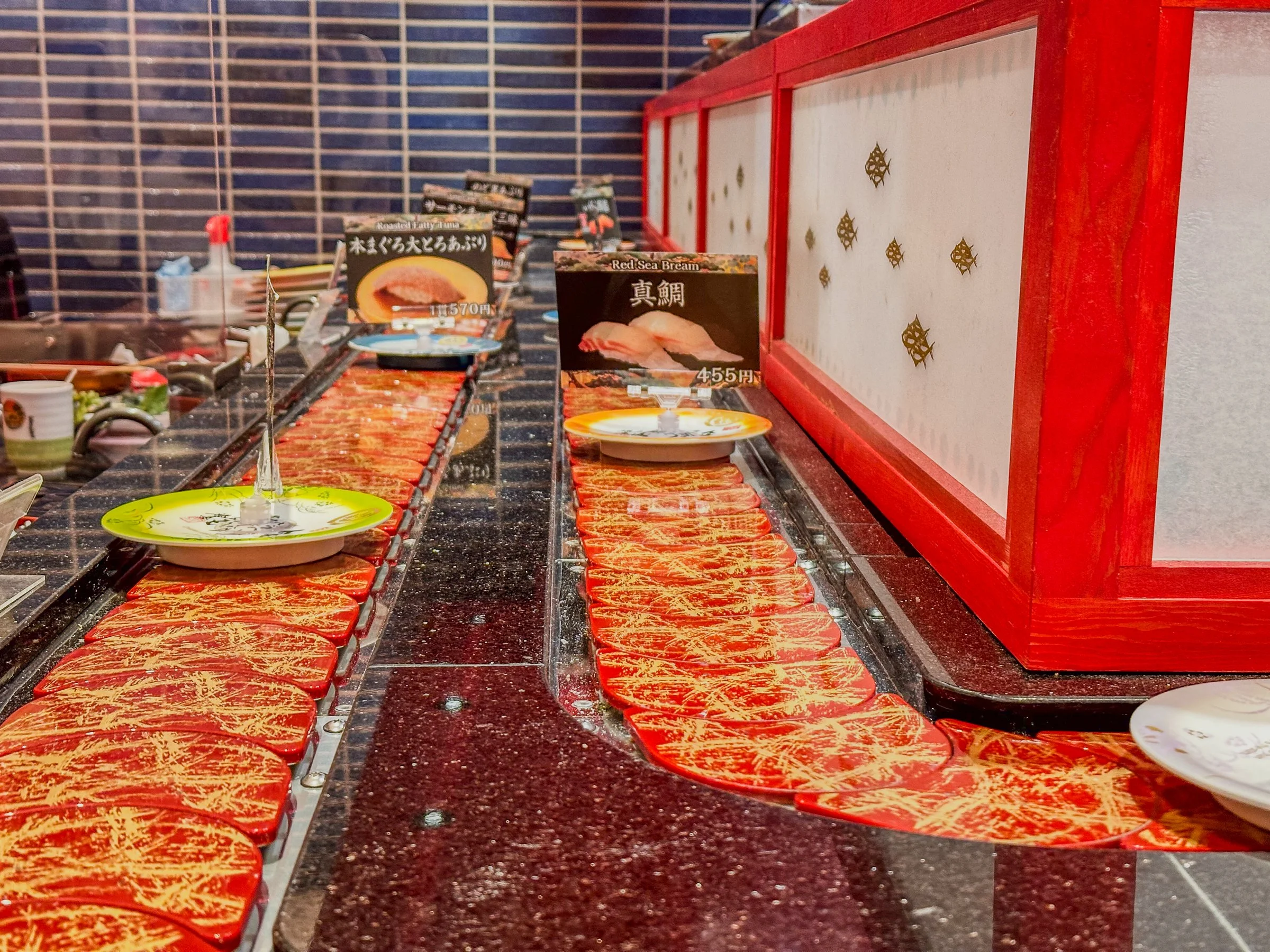 Revolving sushi conveyor belt Tokyo Japan otoro sea bream