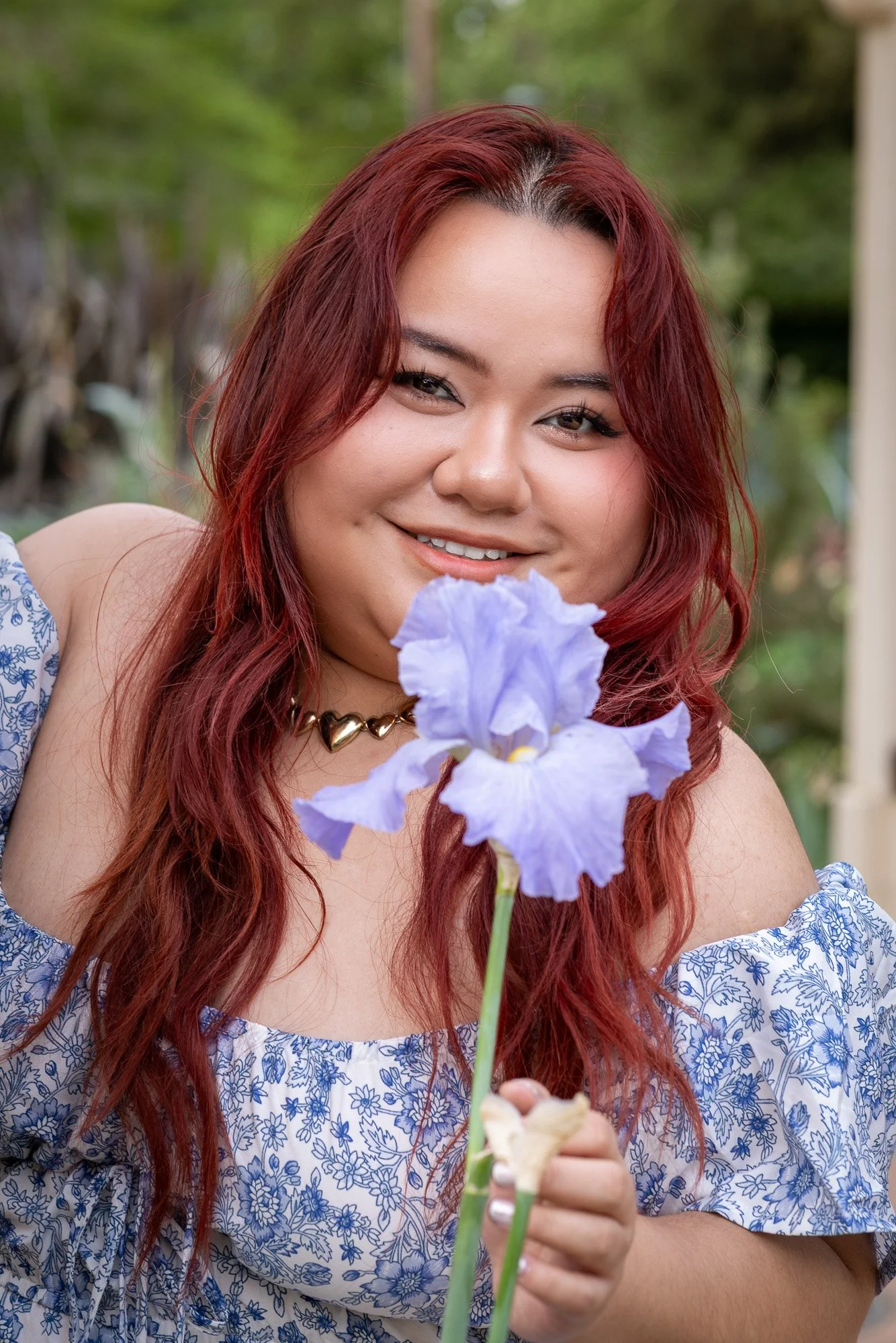Woman looking at purple flower