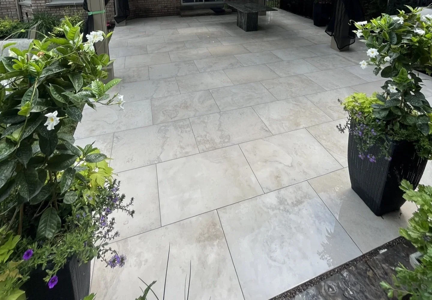 Large-format porcelain patio with planters