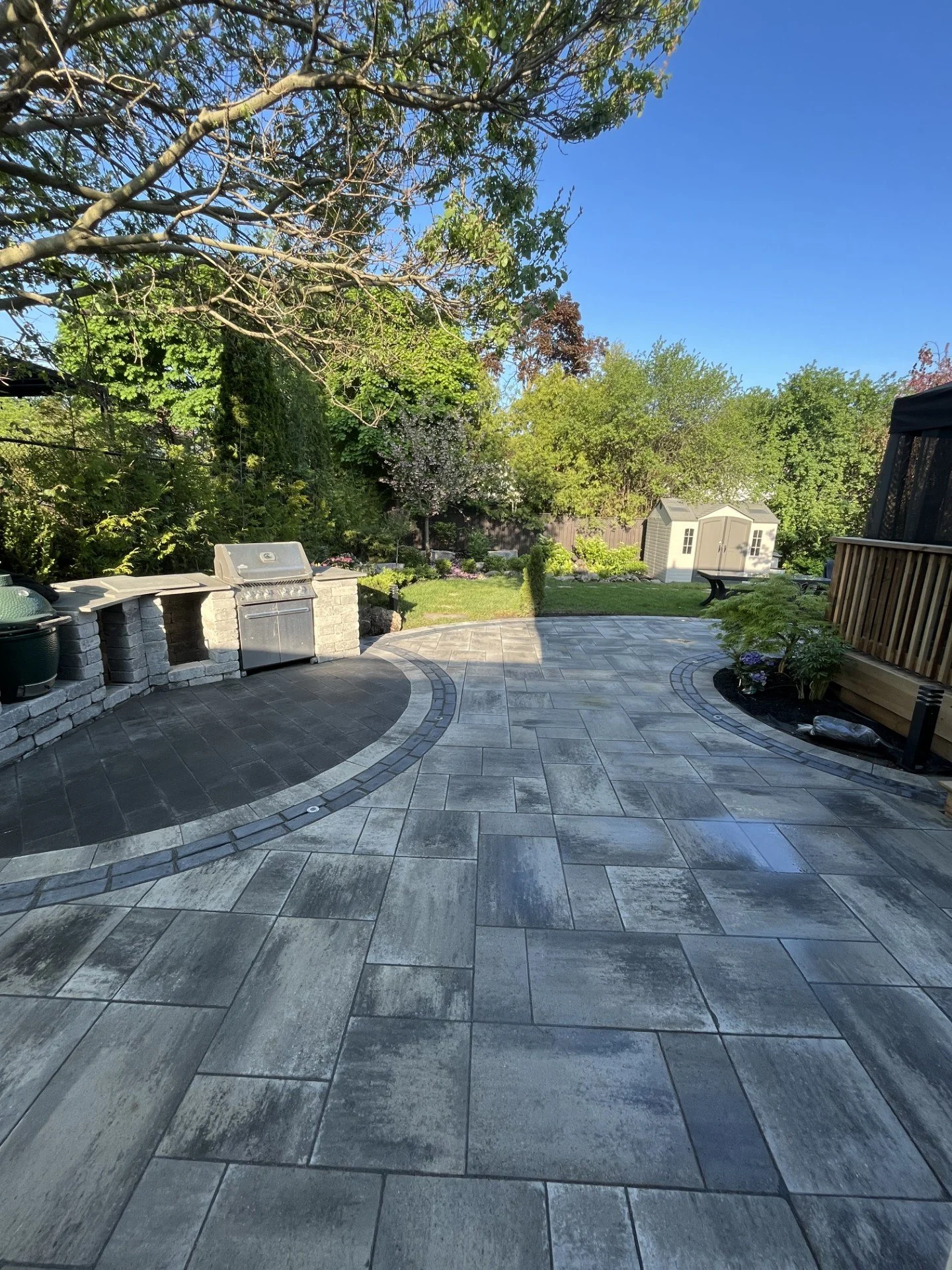 Finished backyard patio with circular inlay