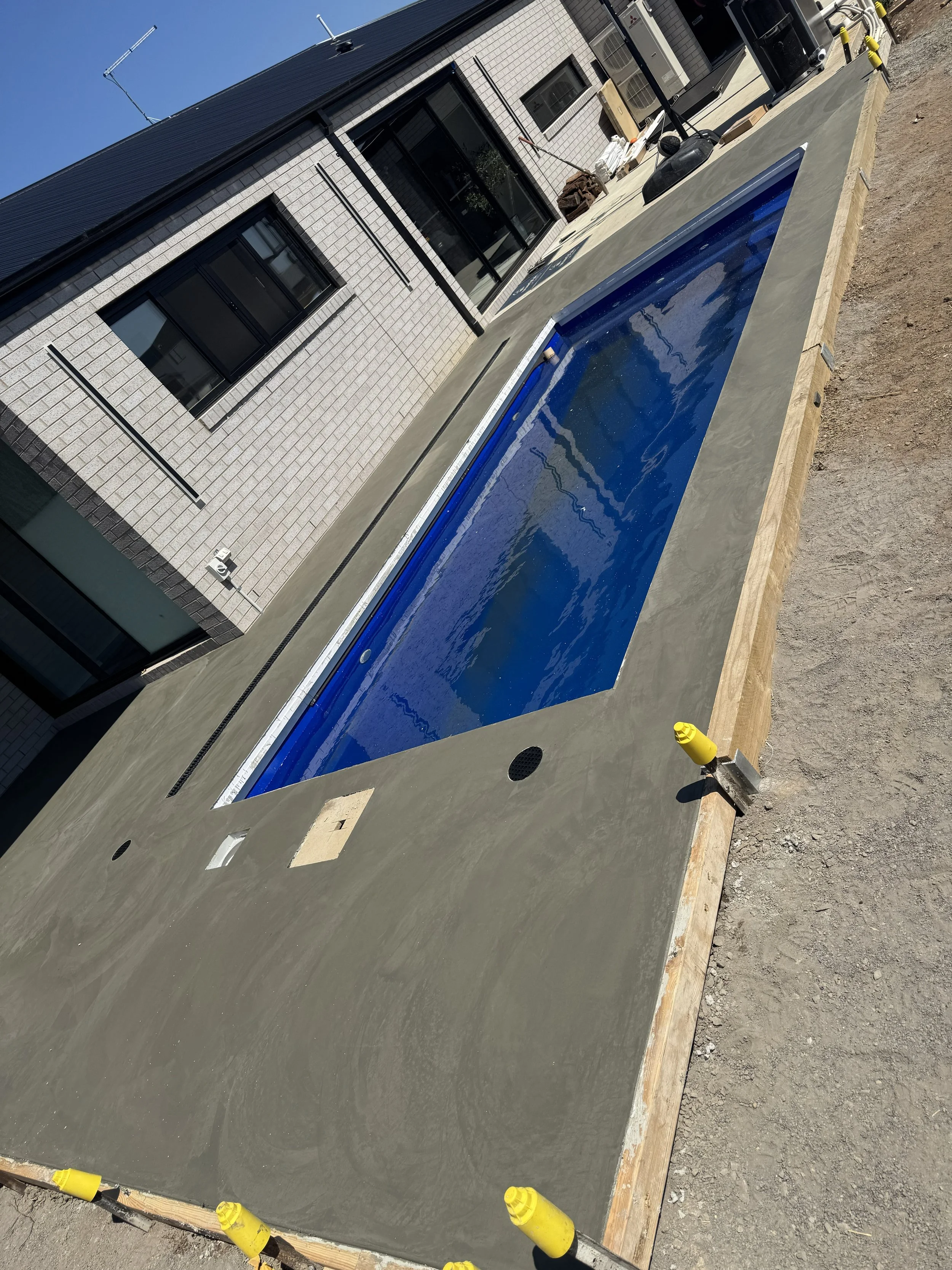 Hans burnished concrete pool surrounds