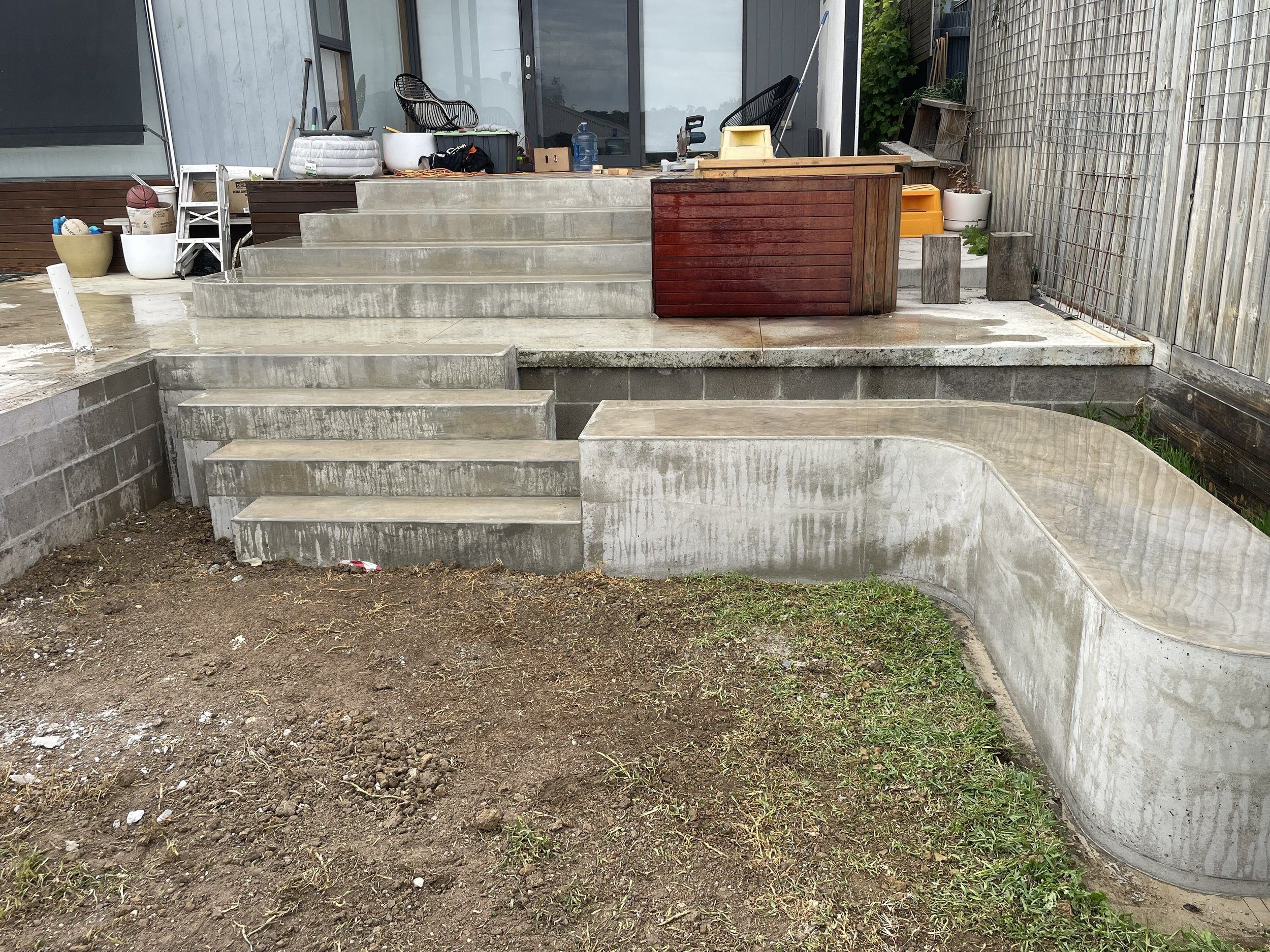 Hand burnished concrete bench seat and block steps