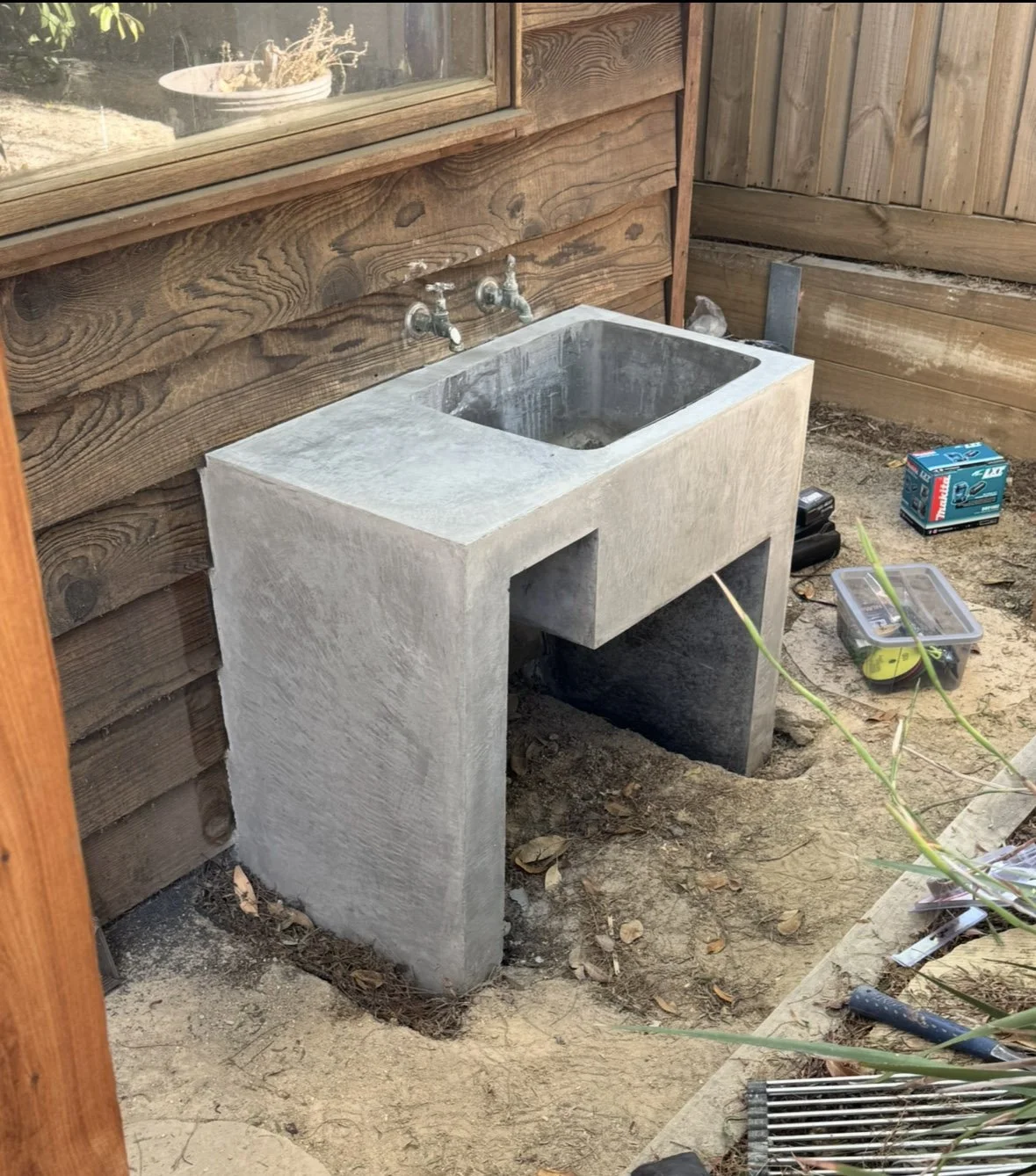 Hand burnished concrete sink stand