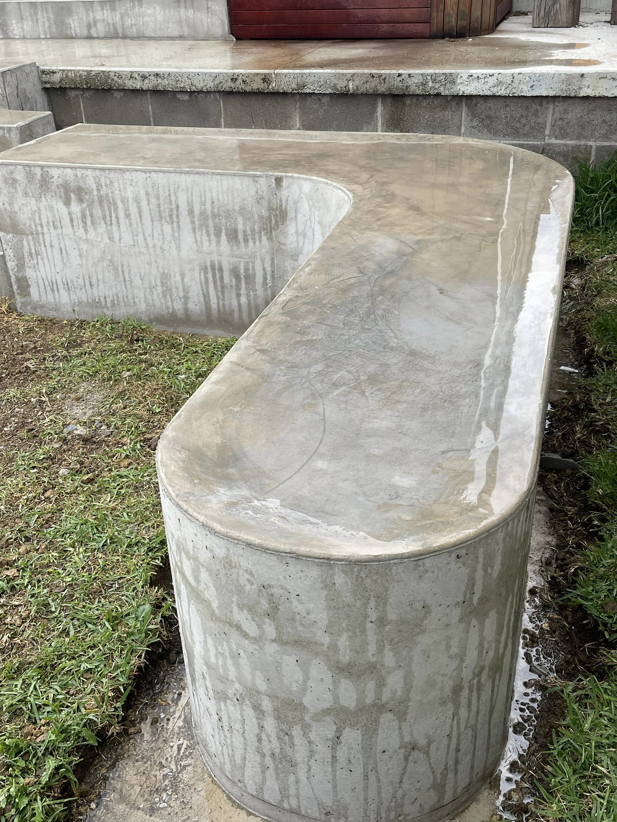 Hand burnished concrete curved bench seat 