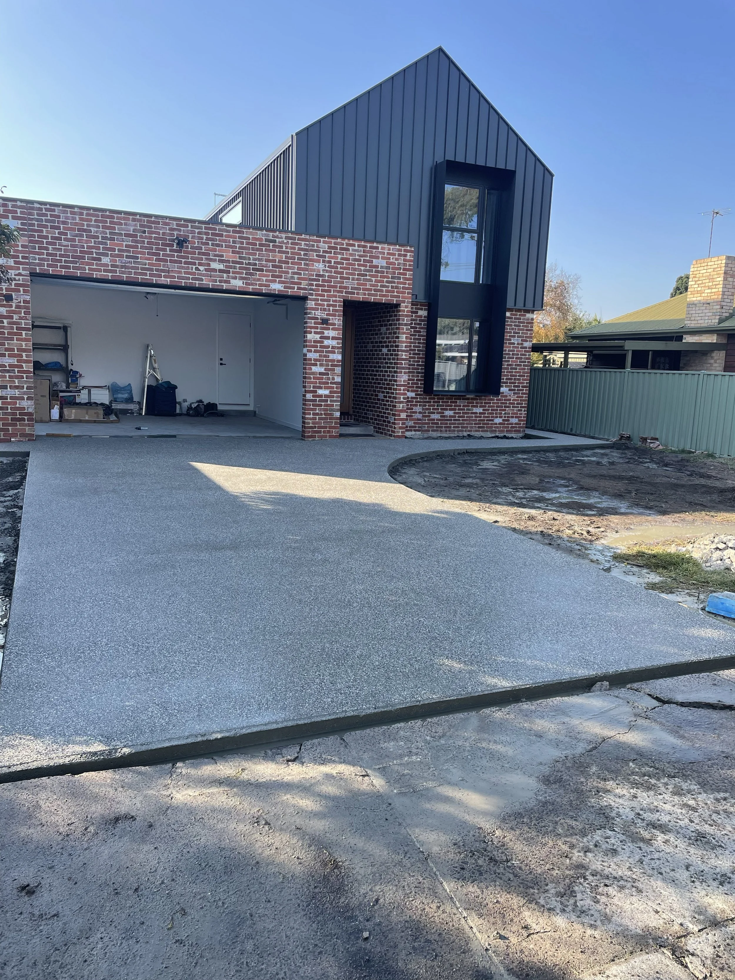 Exposes aggregate driveway