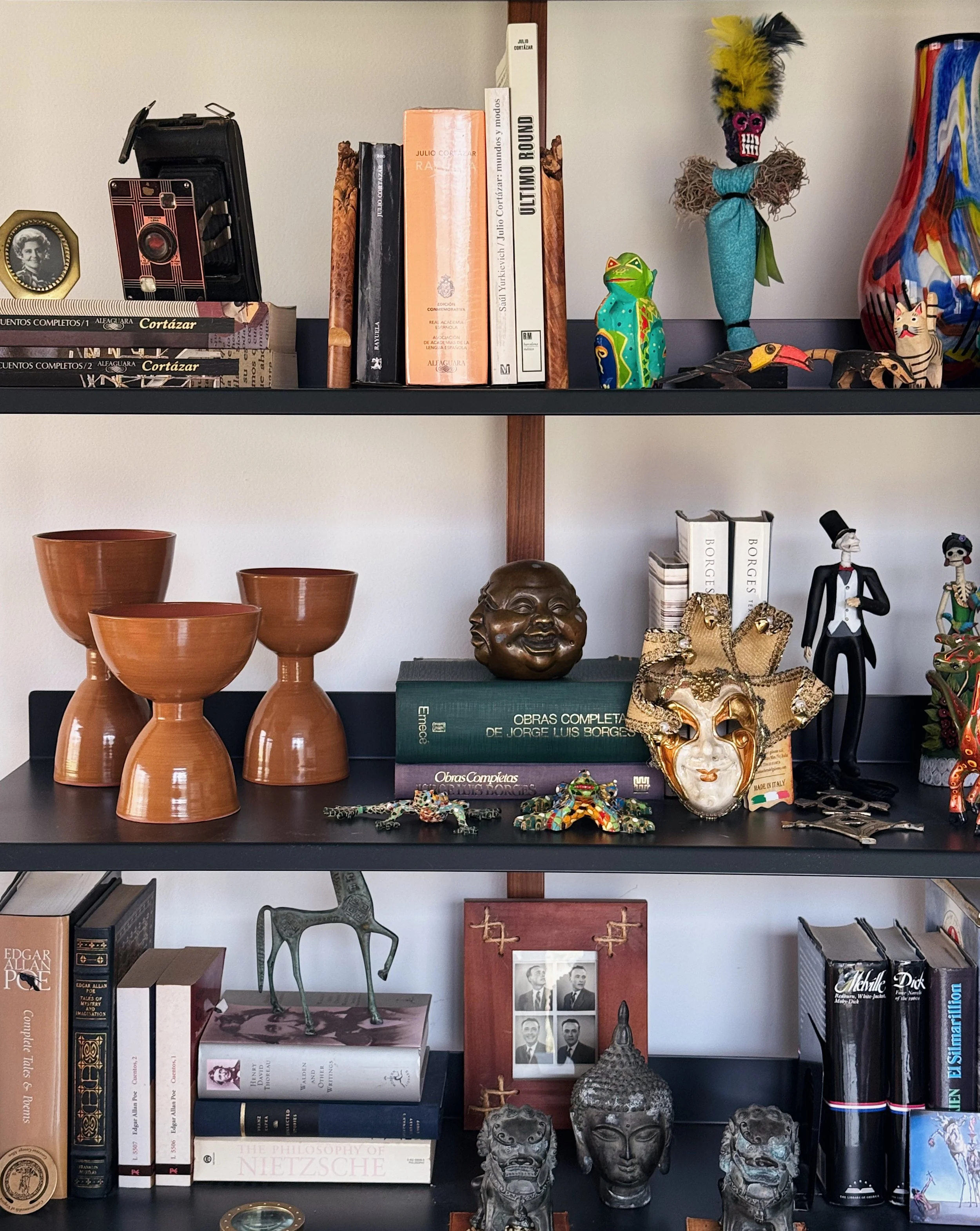 A set of three ceramic minimalistic brown sculptures.