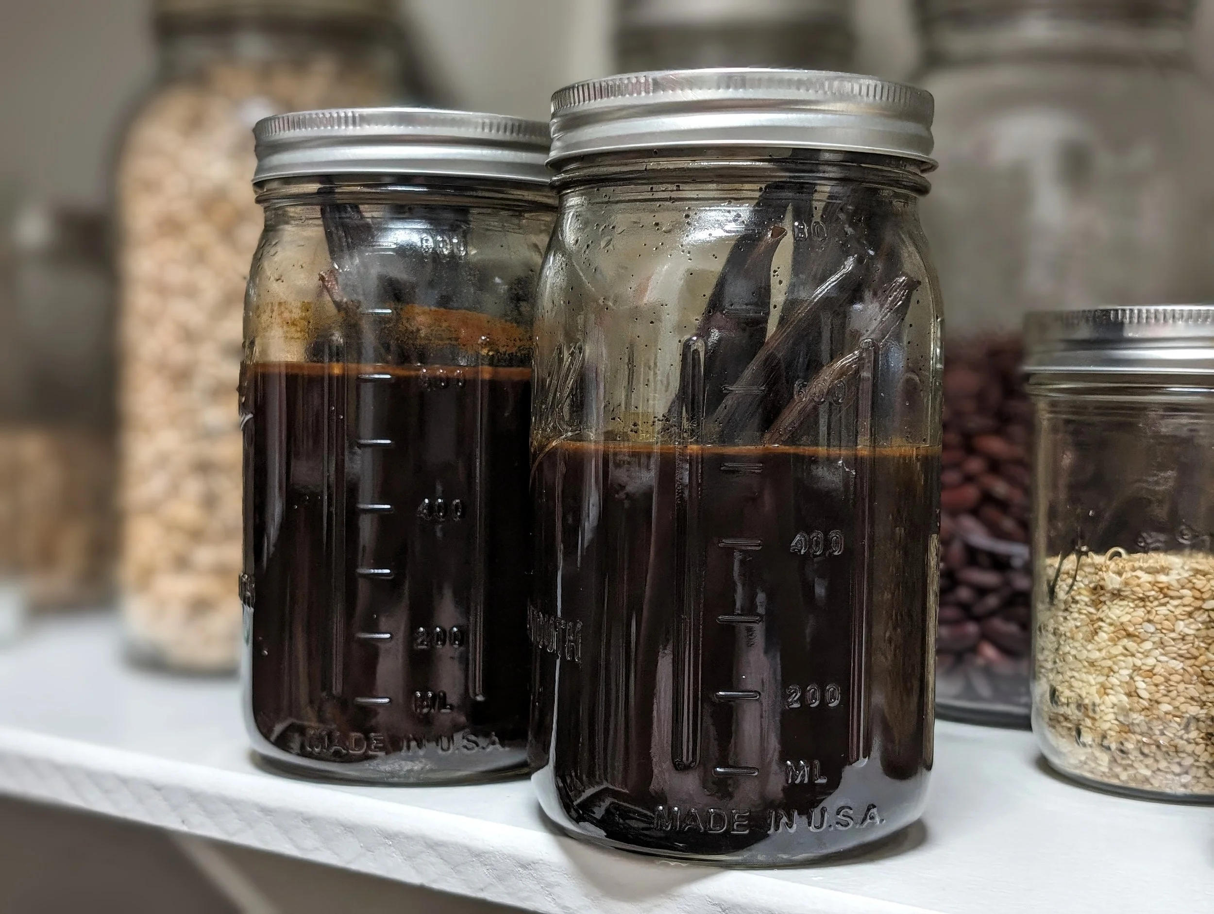 Photo of our homemade vanilla in mason jars