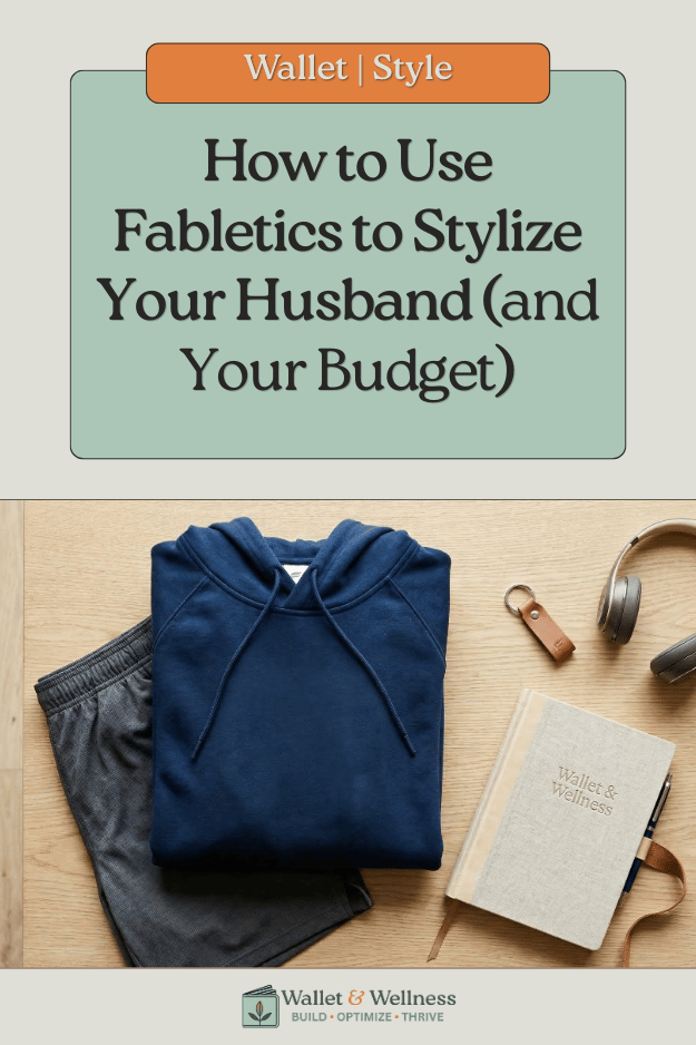 "A flat lay of Fabletics men's athletic wear including 9-inch shorts and a hoodie next to a Wallet & Wellness branded notebook.