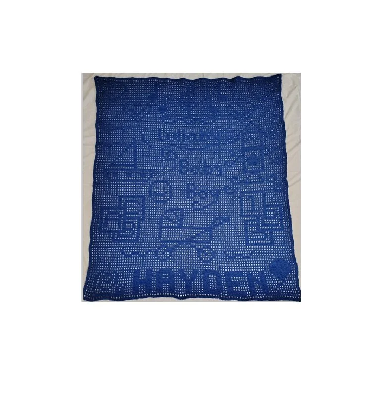 Blue crochet blanket with the name "CHARLIE" at the bottom and various designs and patterns throughout.