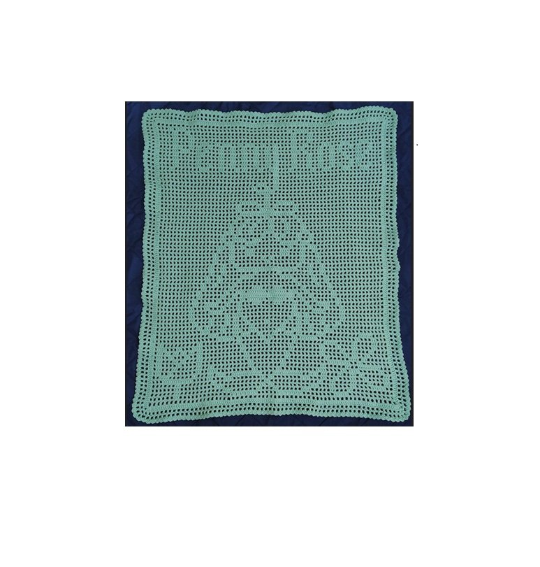 Crocheted rectangular tablecloth with a portrait of a person's face in the center, made from green yarn.