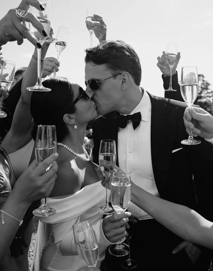 Bride and groom celebrating with guests during a wedding reception in Byron Bay.