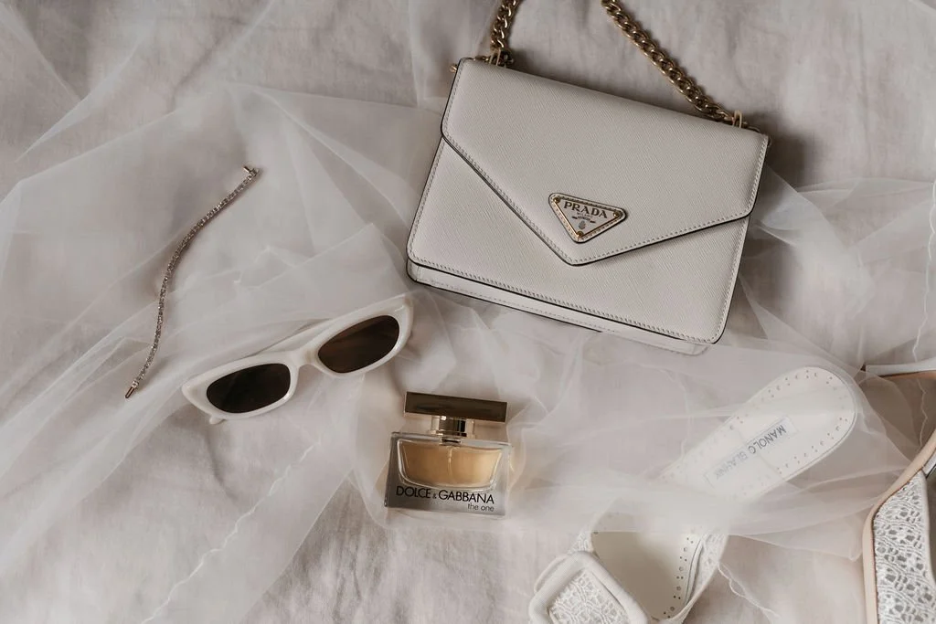 Bridal accessories including perfume, sunglasses and designer details styled for a Byron Bay wedding morning.