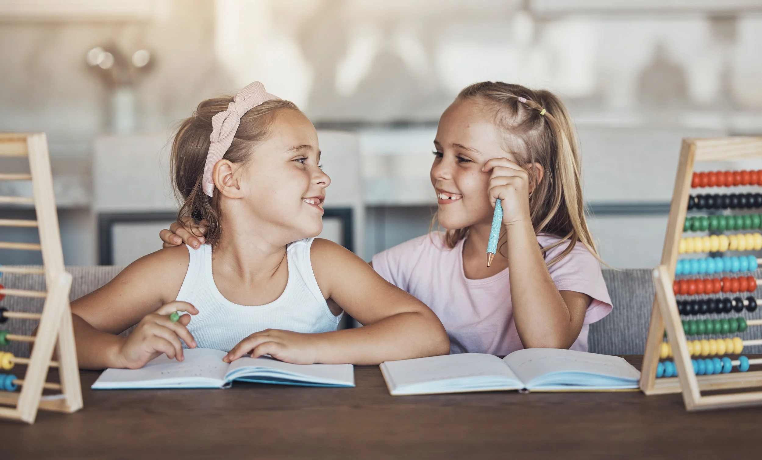 Two children reading together and developing early literacy skills