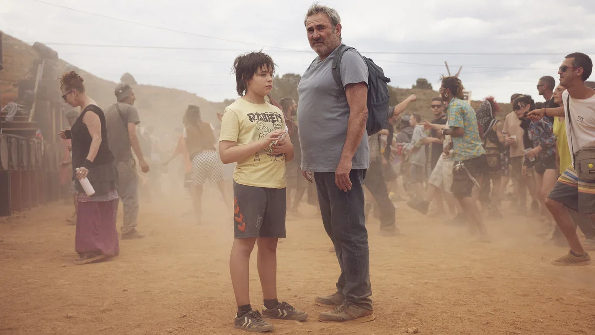 father and son in the middle of an EDM festival